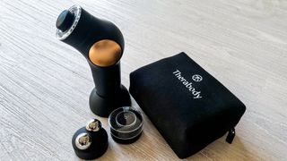 Therabody TheraFace Pro with its attachments and carry case