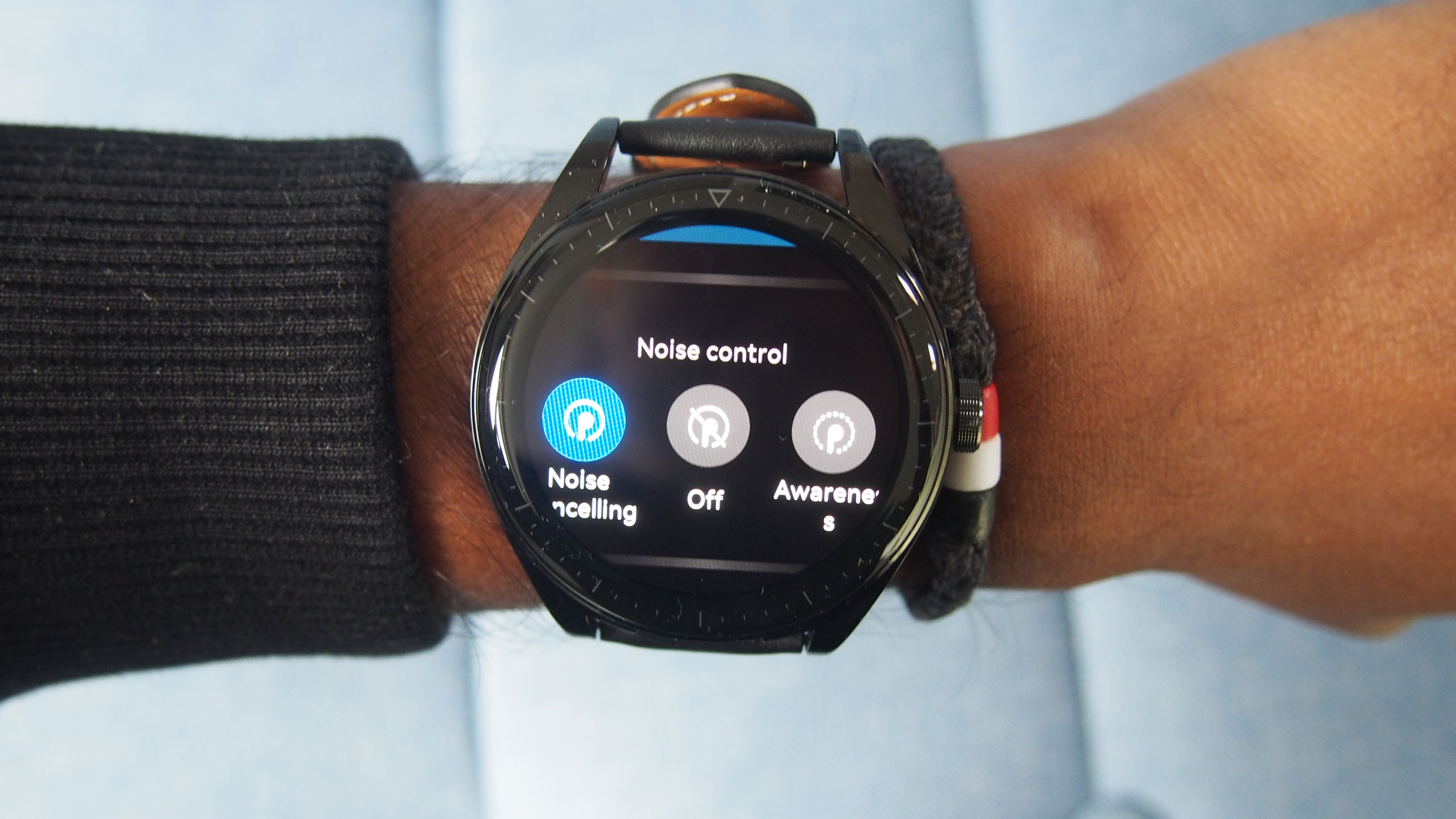 Huawei Watch Buds on blue background