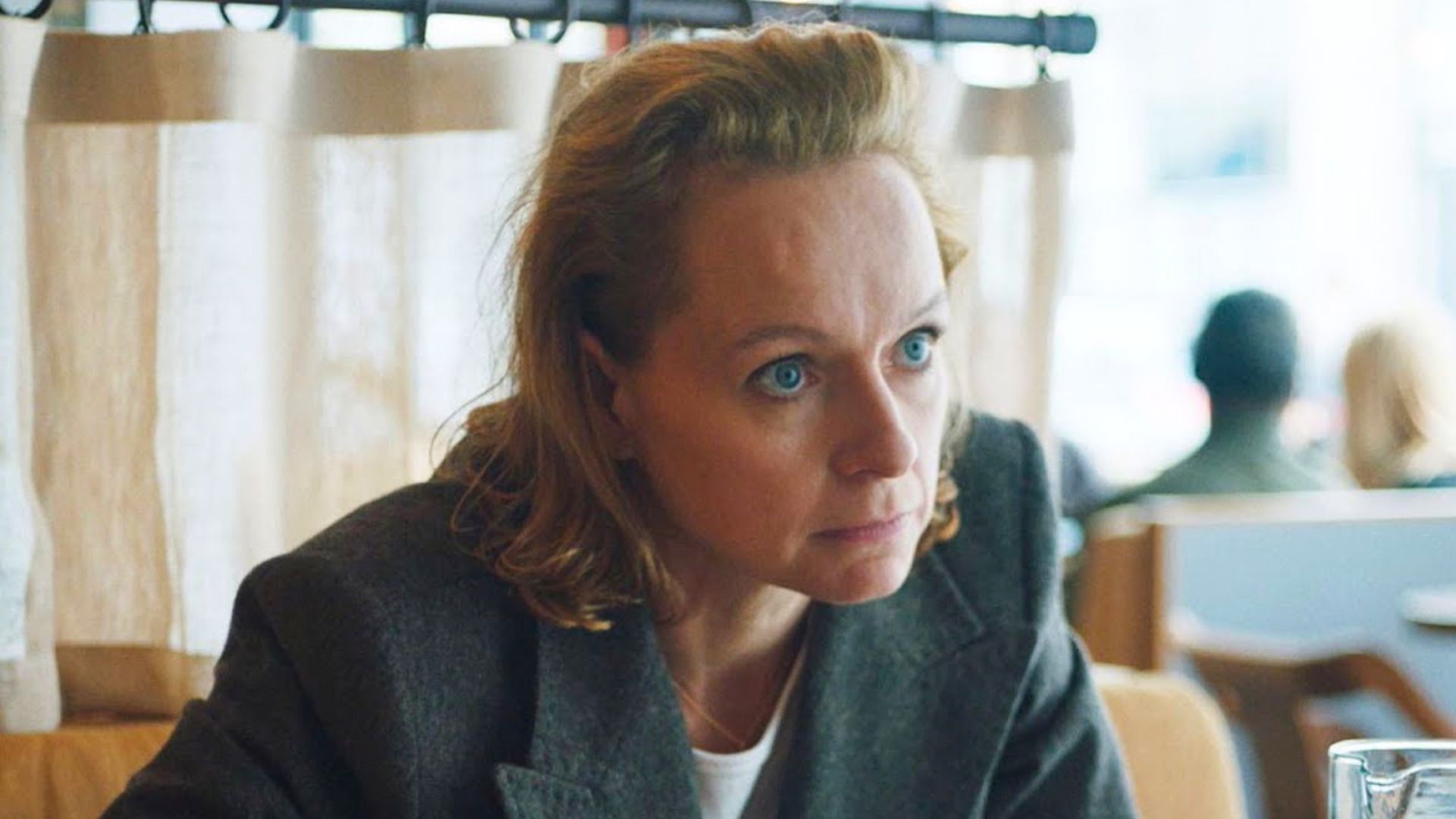 Samantha Morton looks across the table at someone