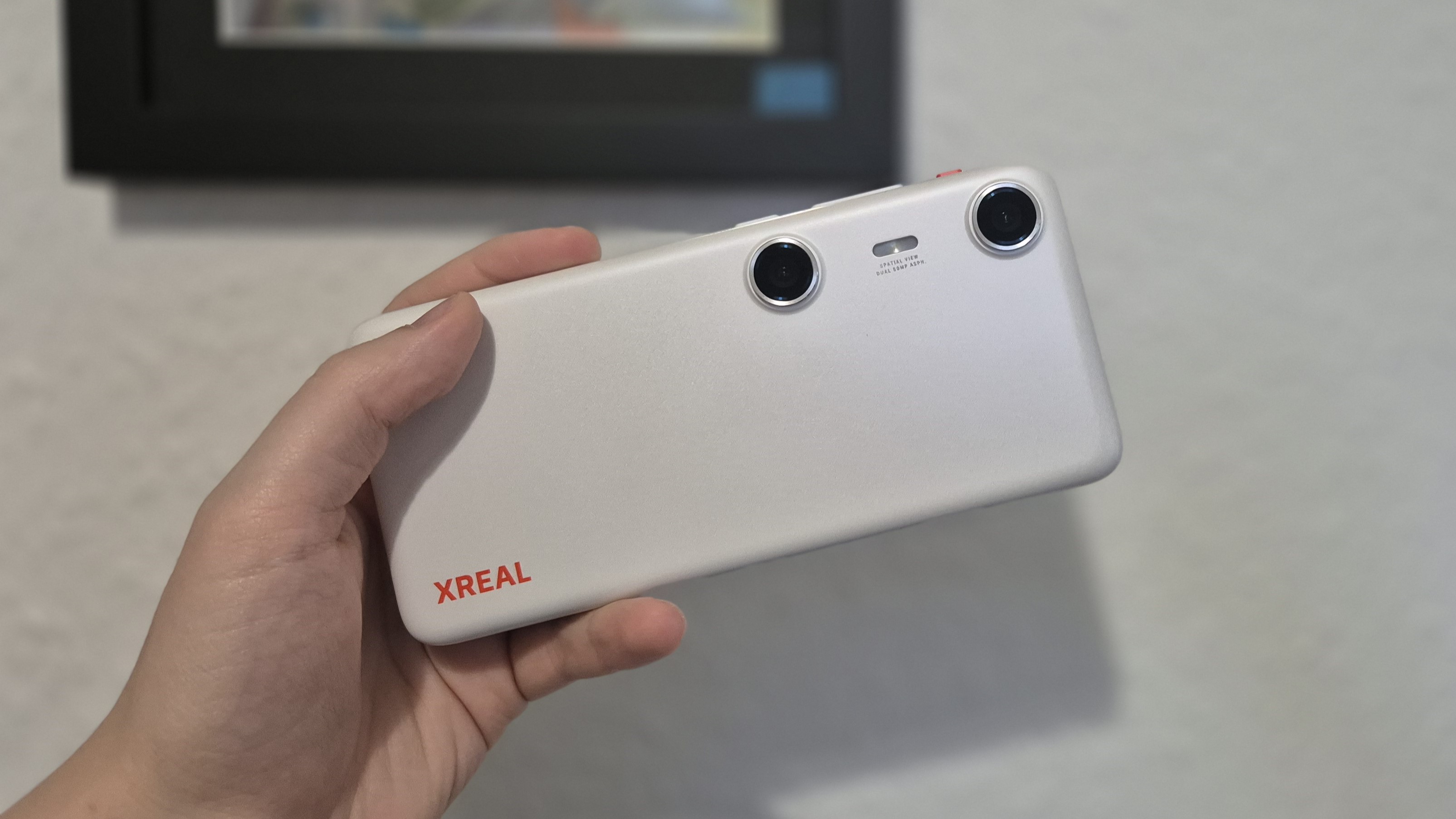 The Xreal Beam Pro in front of a wall