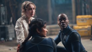 Aliss kneeling next to The Doctor and Bel in Doctor Who season 2 episode 3