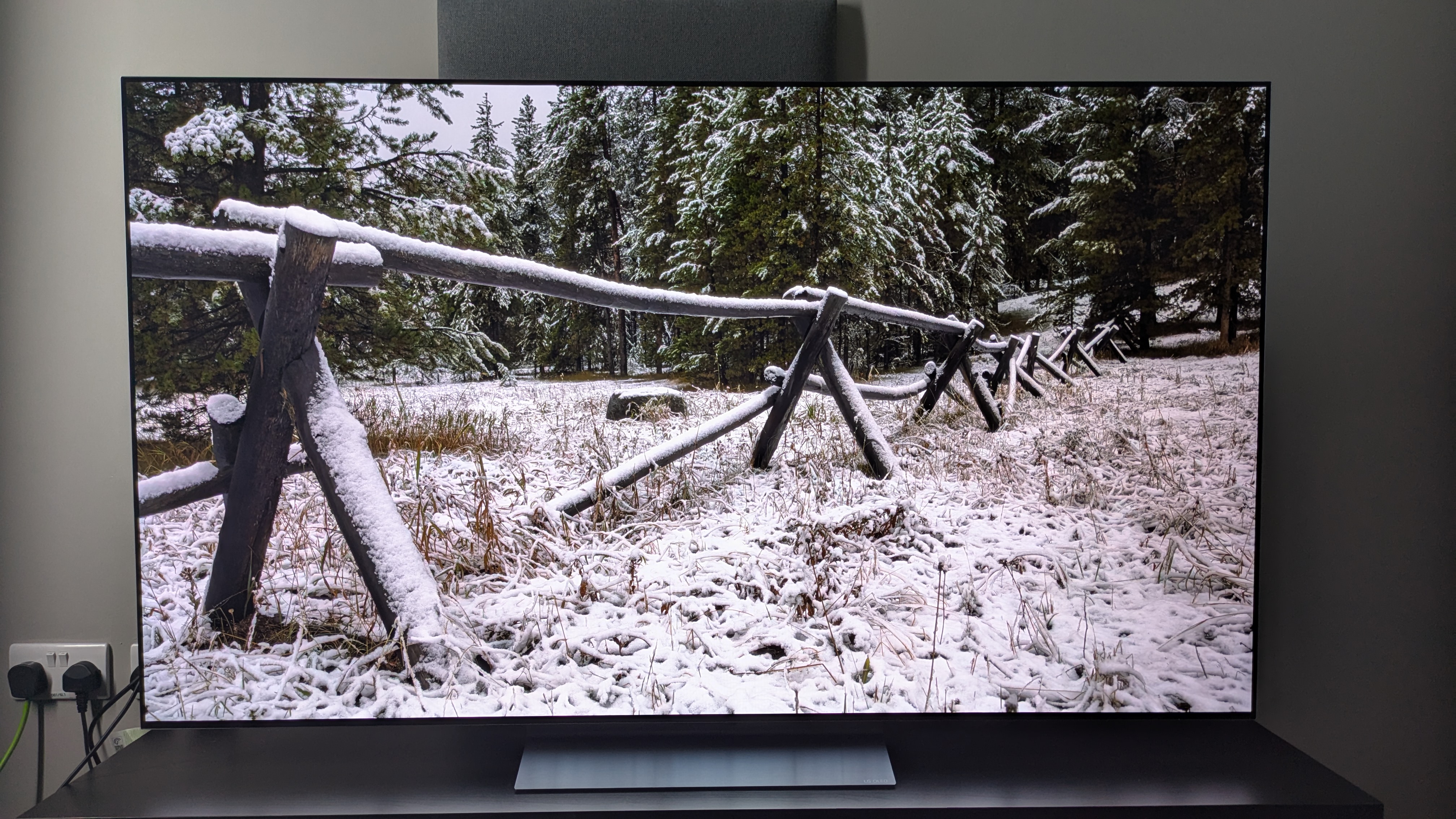 LG C5 with snow covered fence on screen 