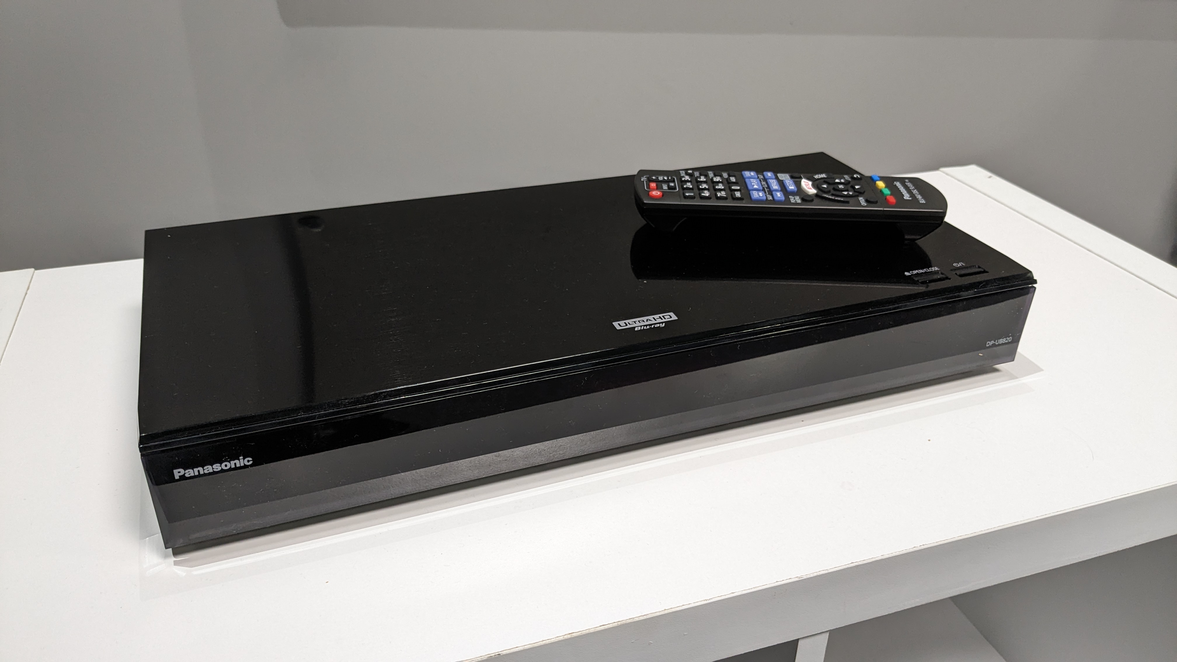 Panasonic DP-UB820 on white stand 