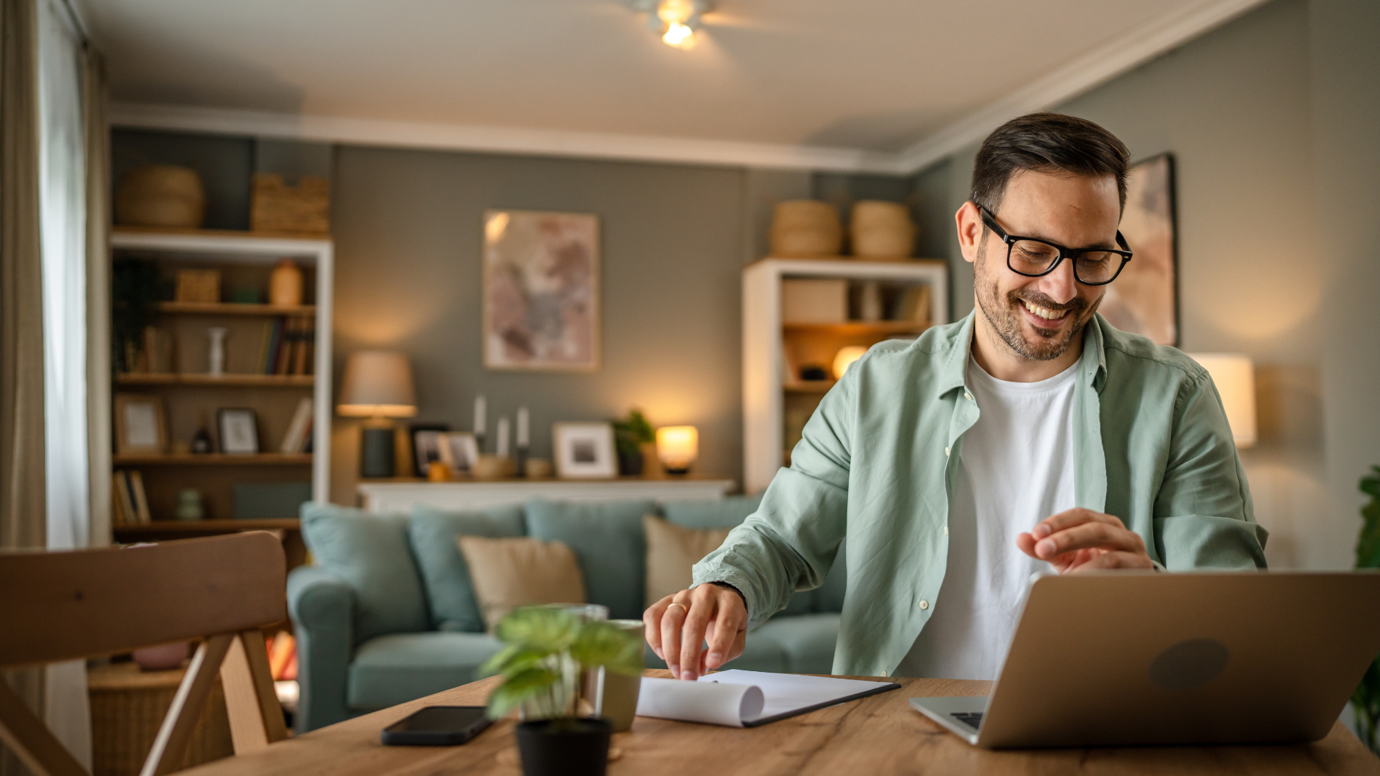 Customer at home looking happy because his network is protected by ESET Home Security