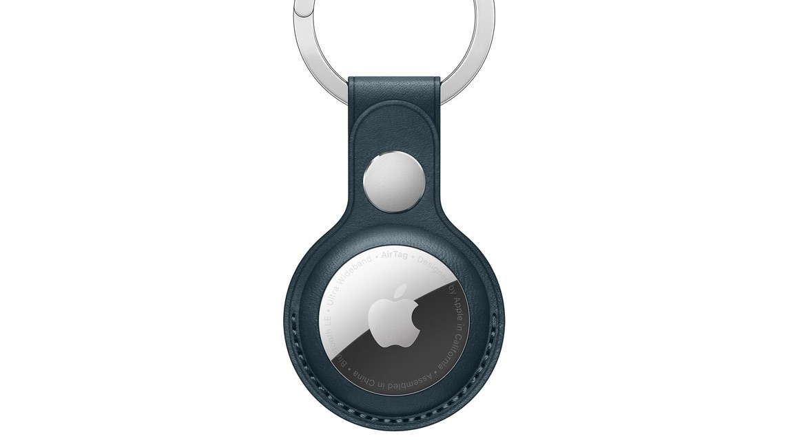 An AirTag inside a leather loop attached to a keychain