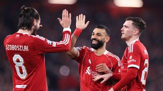 LIVERPOOL, ENGLAND - JANUARY 28: Mohamed Salah of Liverpool (C) celebrates with Dominik Szoboszlai of Liverpool (L) and Andrew Robertson of Liverpool after scoring their 3rd goal during the UEFA Champions League 2025/26 League Phase MD8 match between Liverpool FC and Qarabag FK at Anfield on January 28, 2026 in Liverpool, England. (Photo by Simon Stacpoole/Offside/Offside via Getty Images)