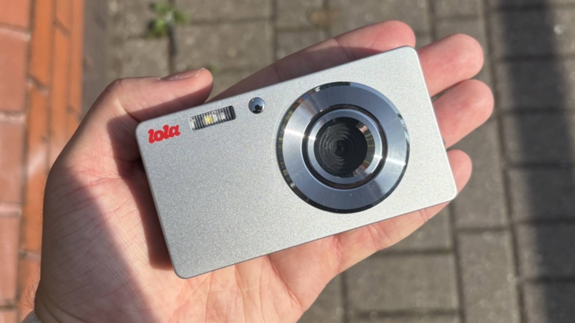 The Lola digital camera in the palm of a hand