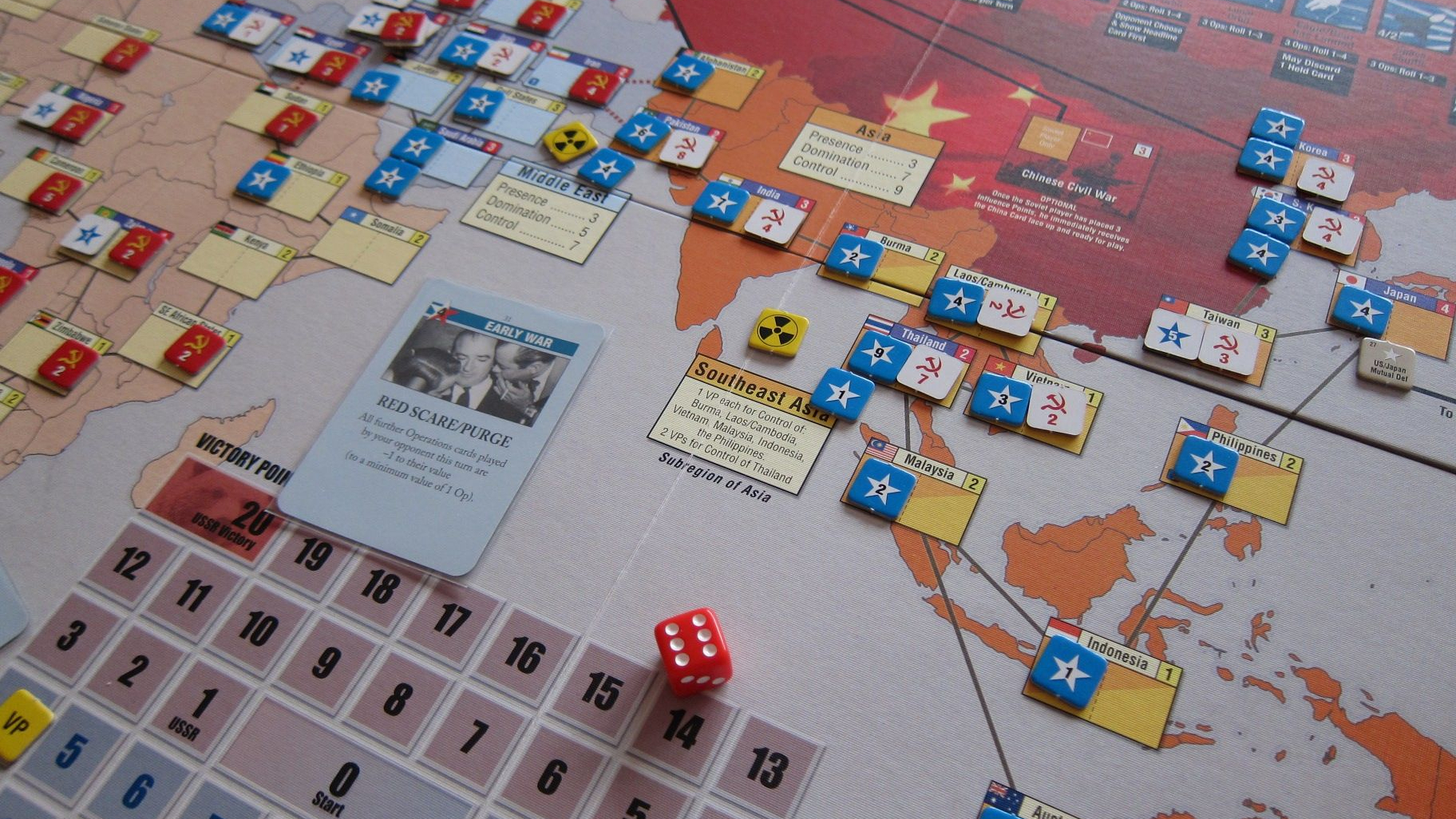 Close up of pieces, dice, and the board from the Twilight Struggle board game