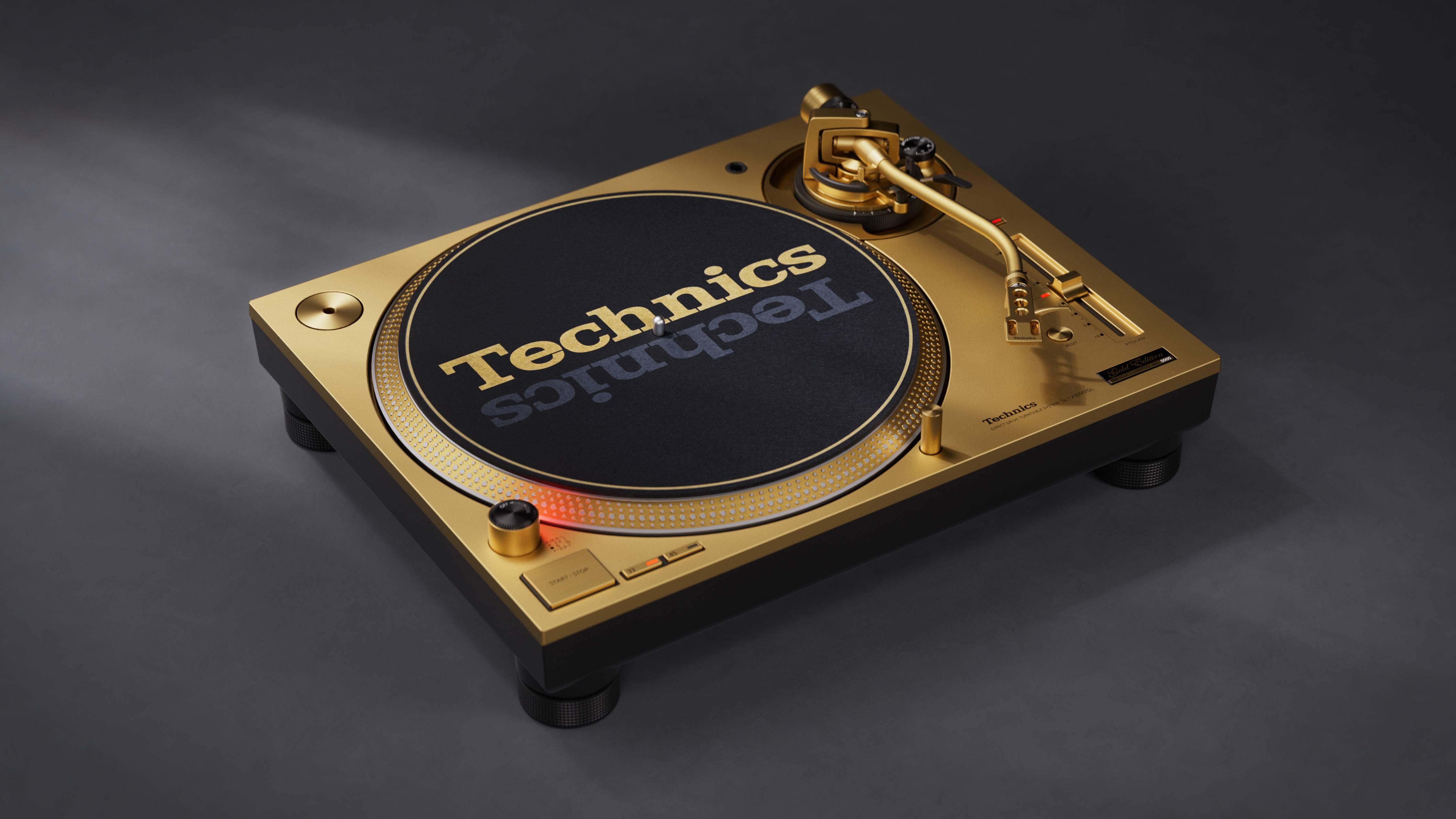 The gold model Technics SL-1200M7 55th anniversary limited edition on a gray background.