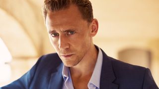 Tom Hiddleston as Jonathan Pine in a suit