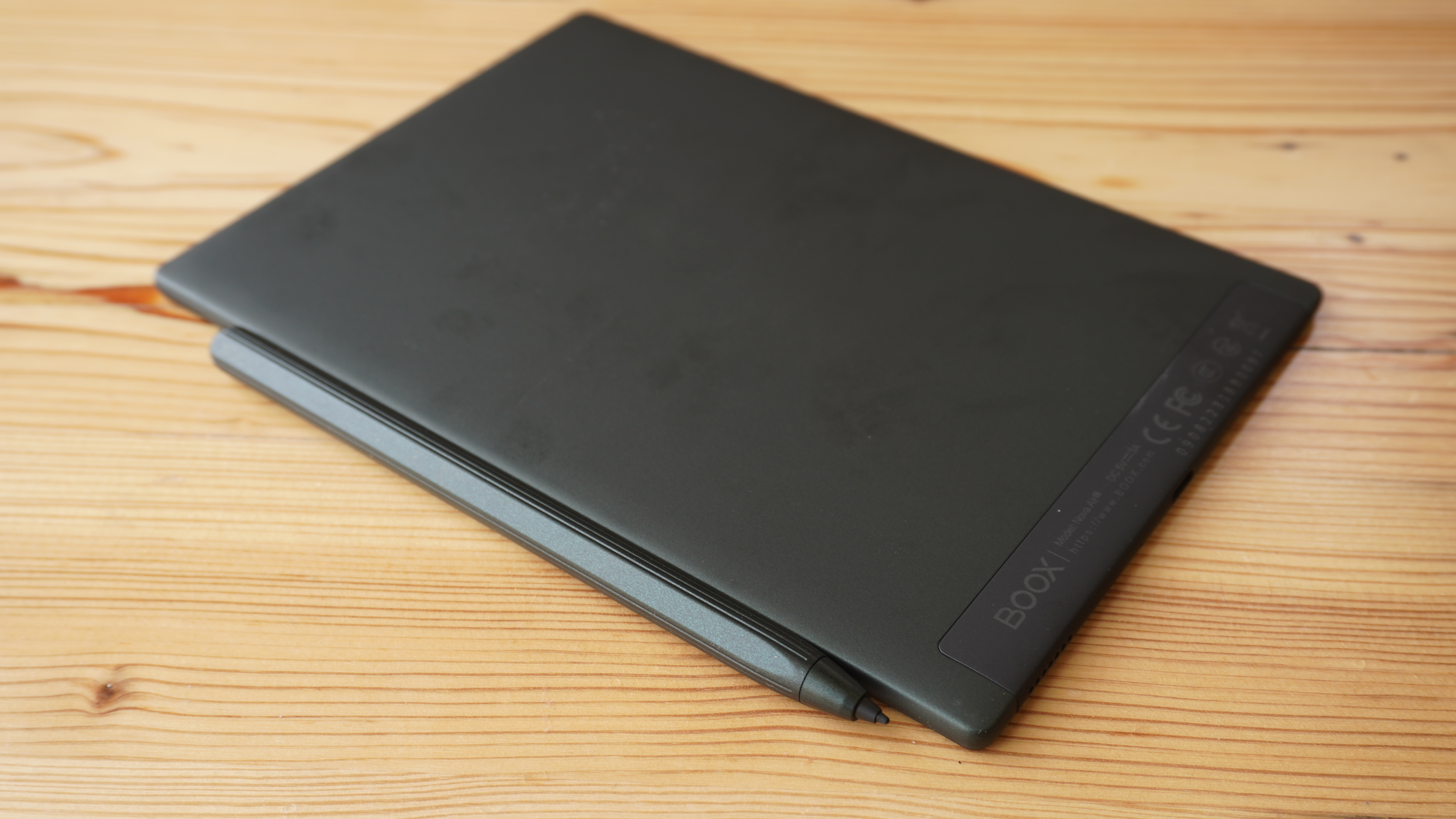 The Onyx Boox Nova Air C from the back, resting on a wooden surface