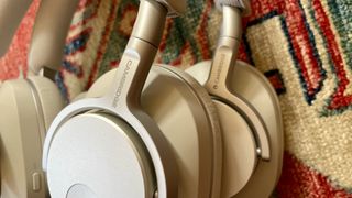 Cambridge Audio Melomania P100 with the original P100, either worn by Becky Scarrott or next to each other, to illustrate the similarities