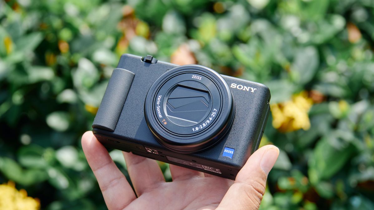 Man holding the Sony ZV-1 compact camera