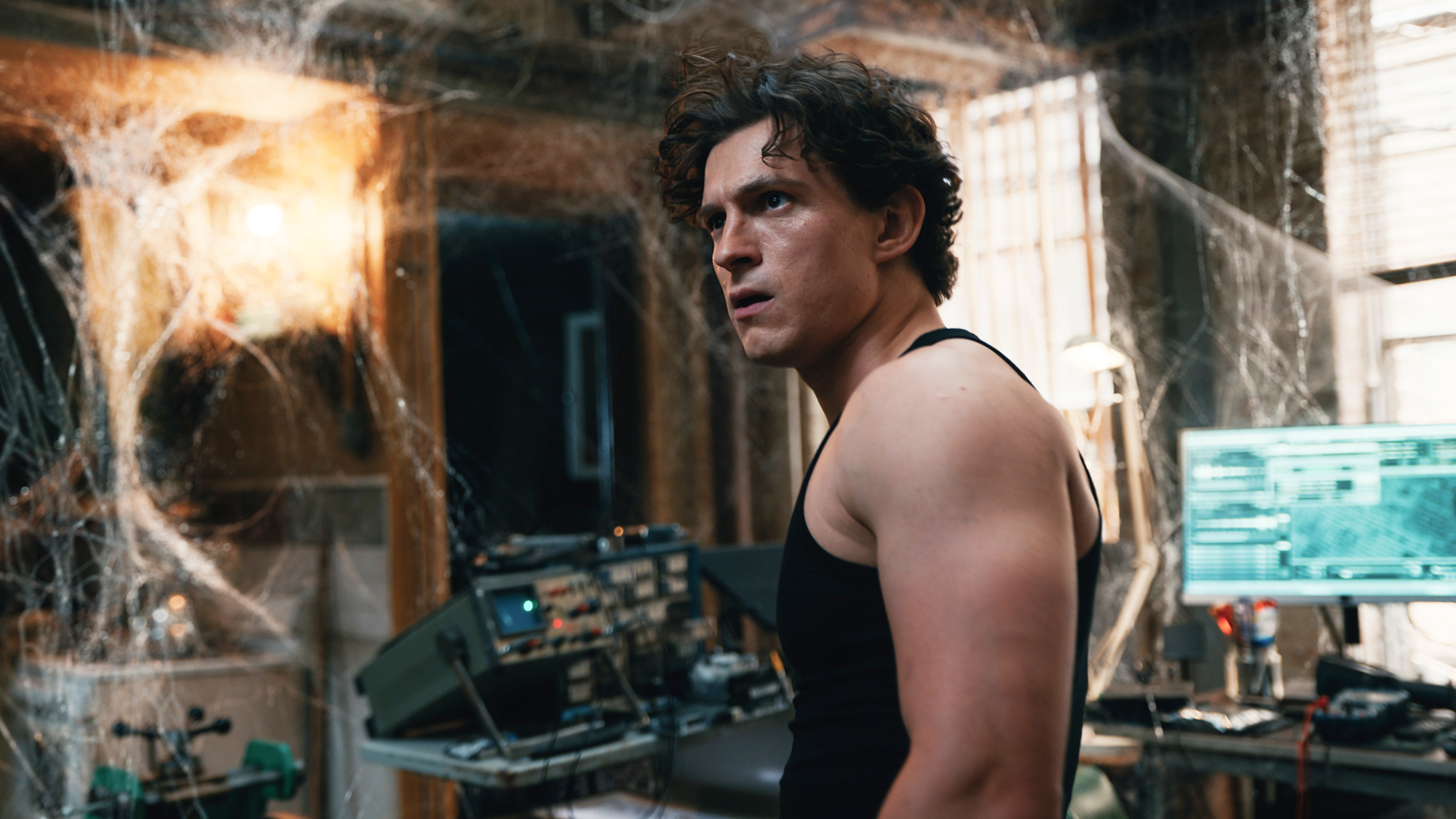 Peter Parker looking at a load of spider webs in his room in Spider-Man: Brand New Day