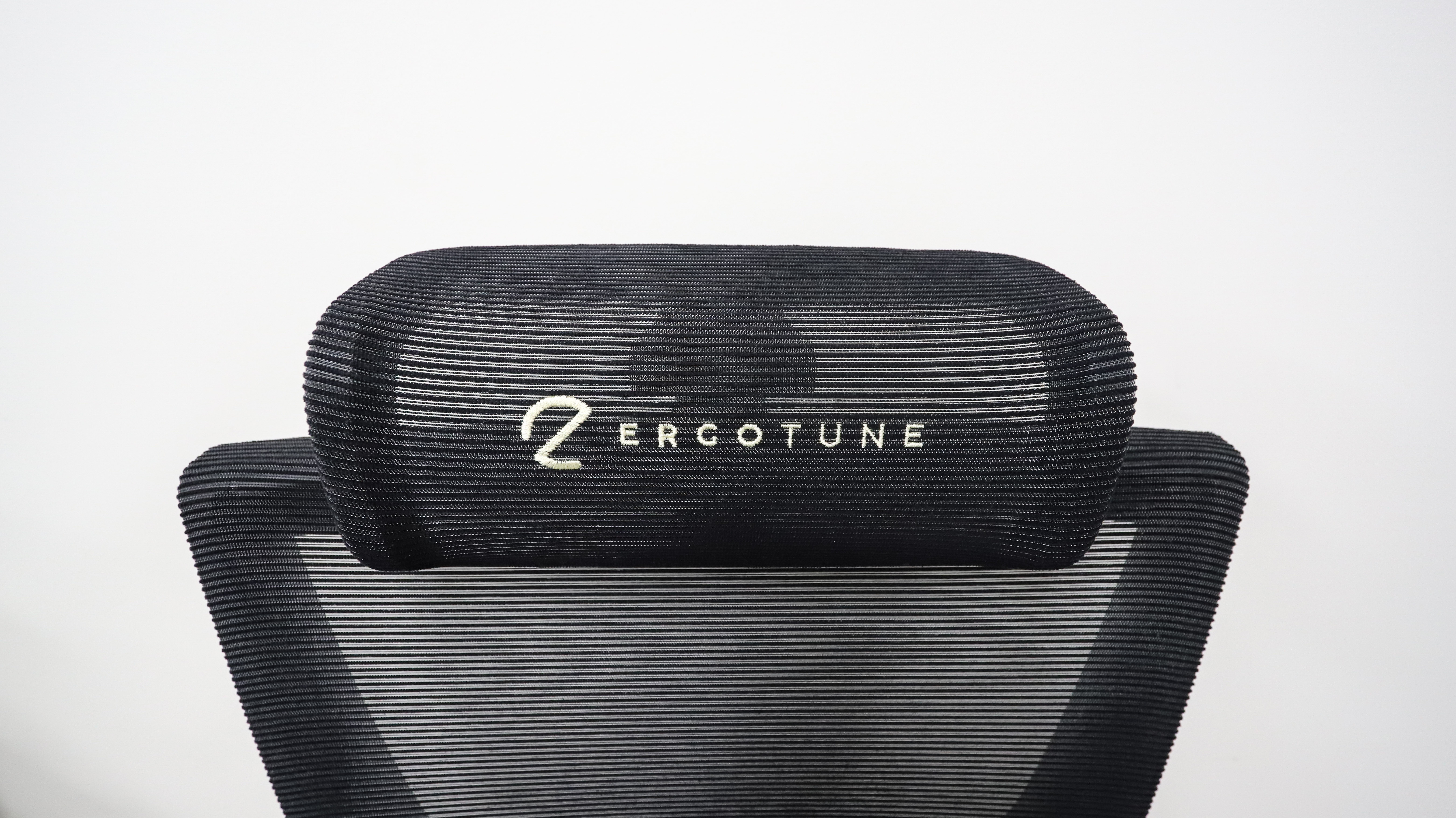 ErgoTune branding on the Supreme's neck support