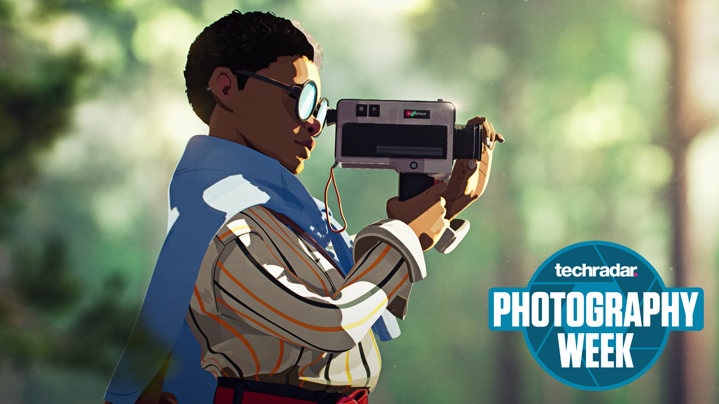 A boy holding a film camera to his face