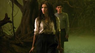 Agatha stands on the Witches' Road with Billy behind her in Agatha All Along episode 8