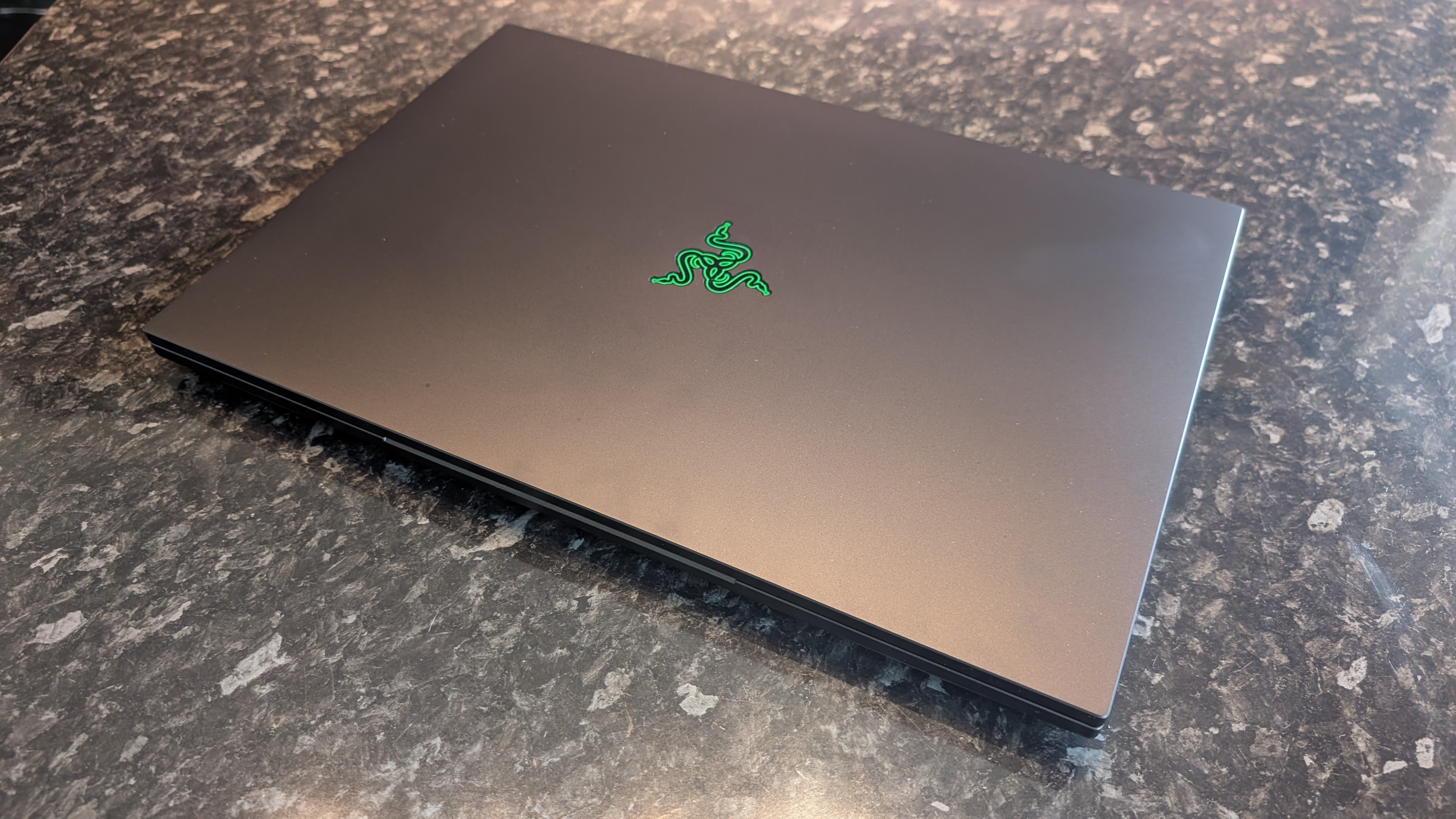 The Razer Blade 18 (2026) pictured on a black marble worktop.