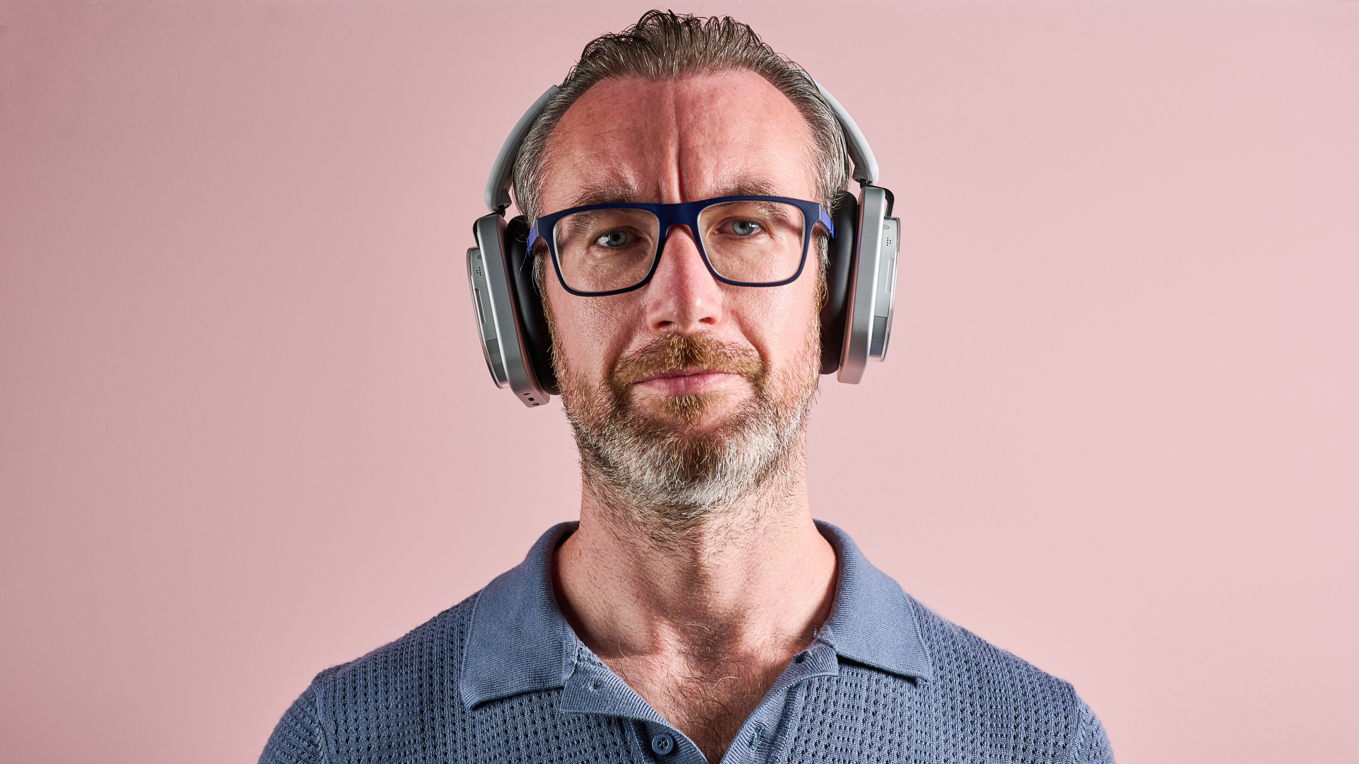 The Nothing Headphone (1) worn by man facing the camera directly
