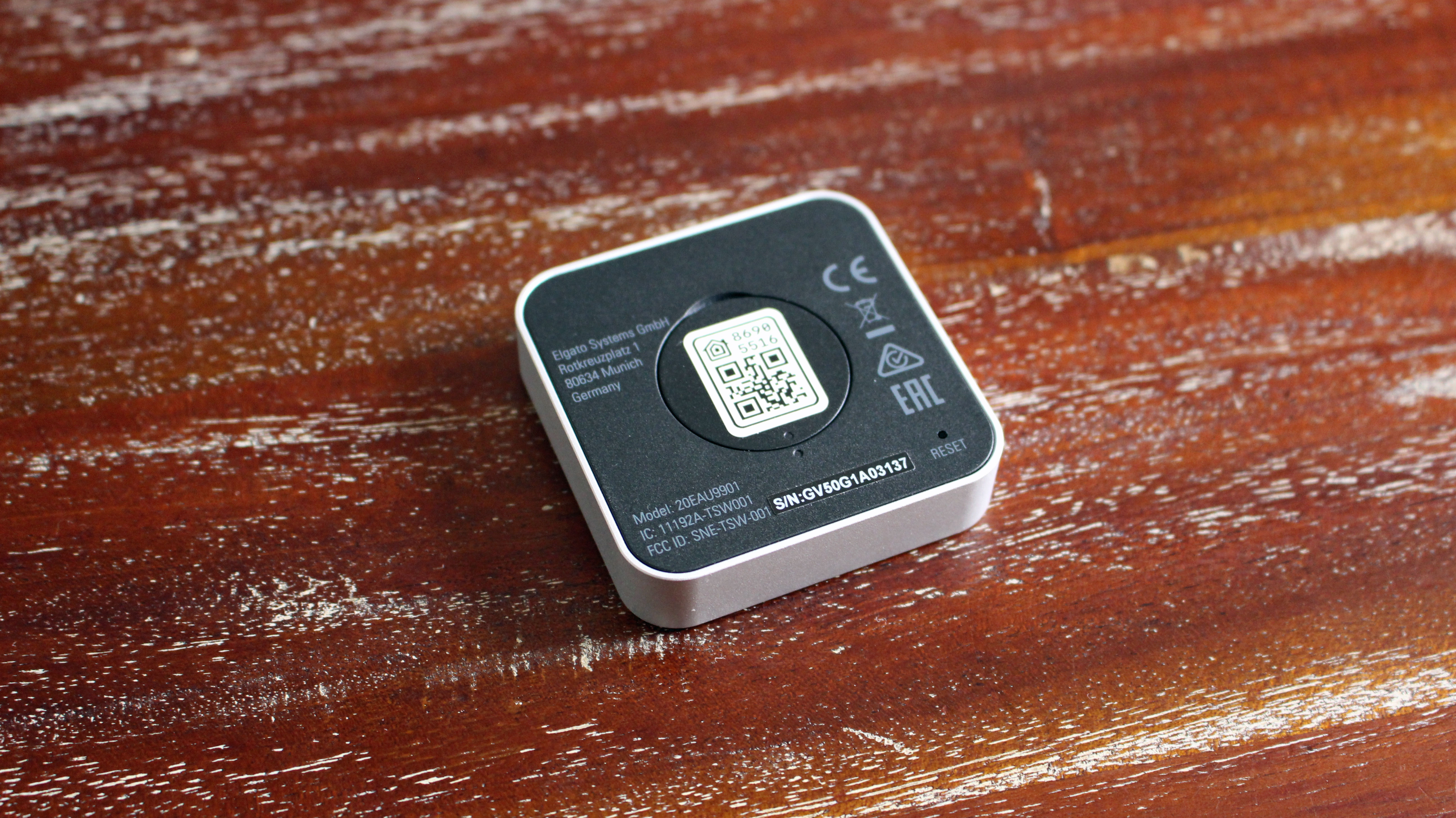 The back of the Elgato Eve Button with its QR code