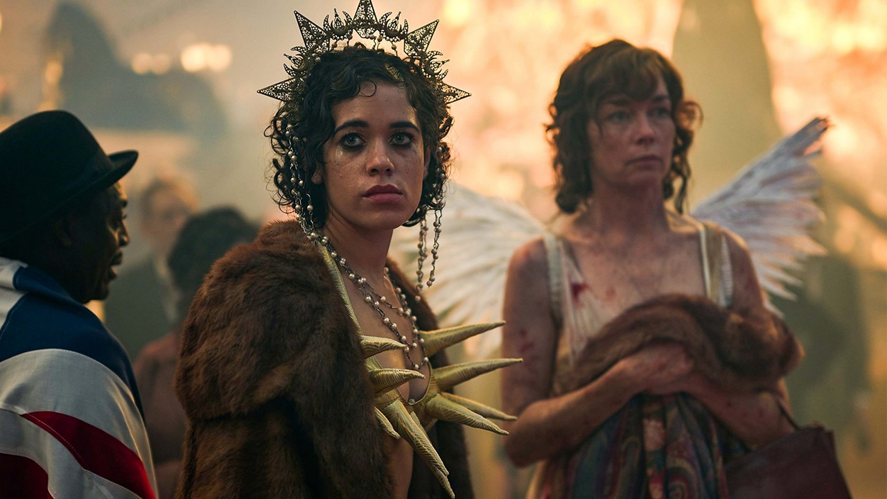 Billie Cassidy (Uni Meyers) and Kate Galloway (Julianne Nicholson) stand wearily in their soiled club costumes as London celebrates the end of World War 1 in a crowded Trafalgar Square in historical drama Dope Girls.