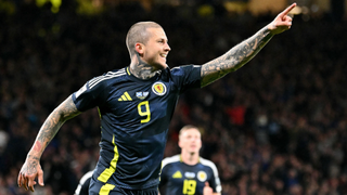 Lyndon Dykes celebrates scoring the team's third goale during the 2026 World Cup Group C qualifier football match between Scotland and Greece, at Hampden Park Stadium, in Glasgow, on October 9, 2025. 