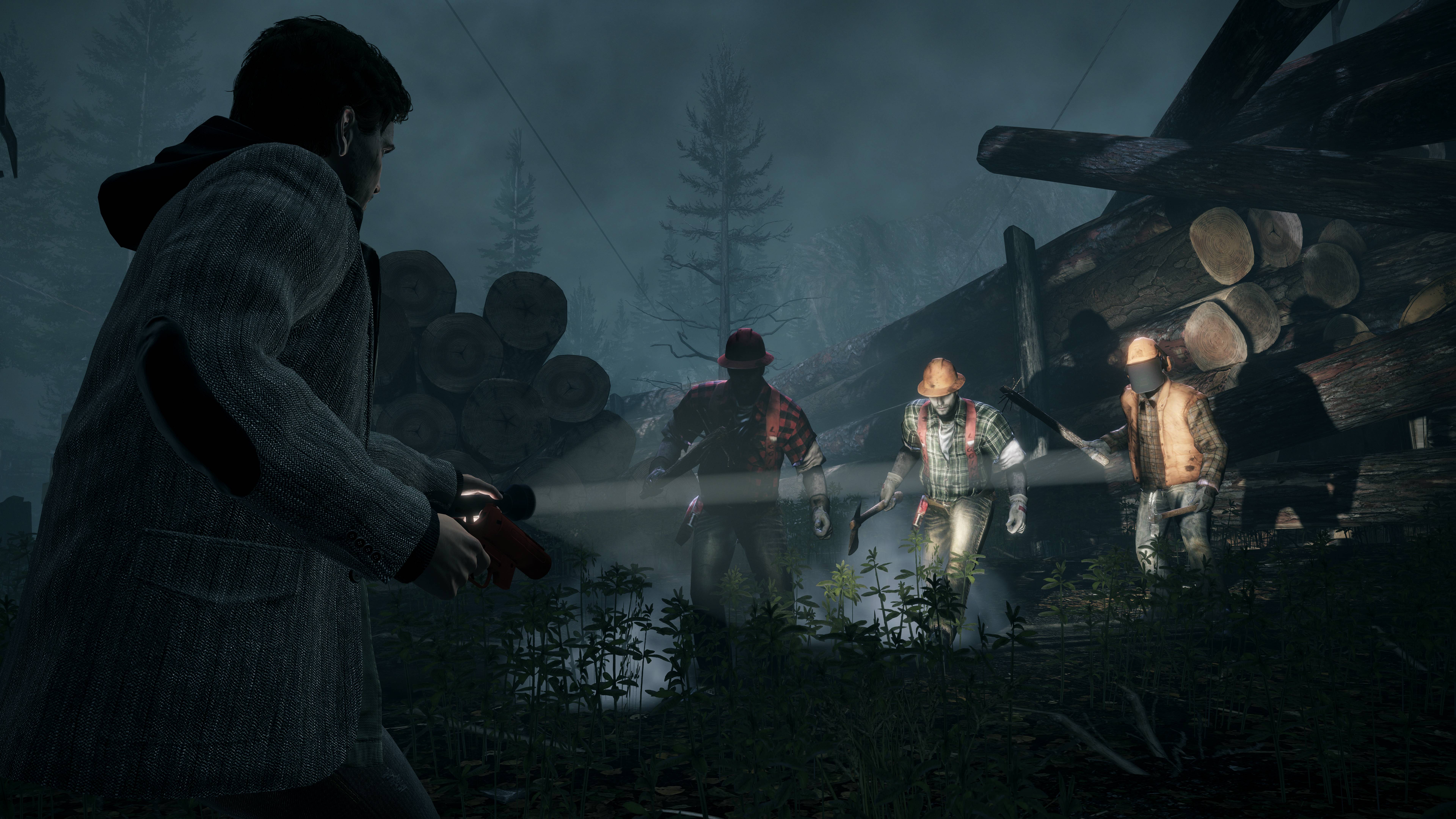 Alan Wake facing off against three taken enemies in Alan Wake Remastered 