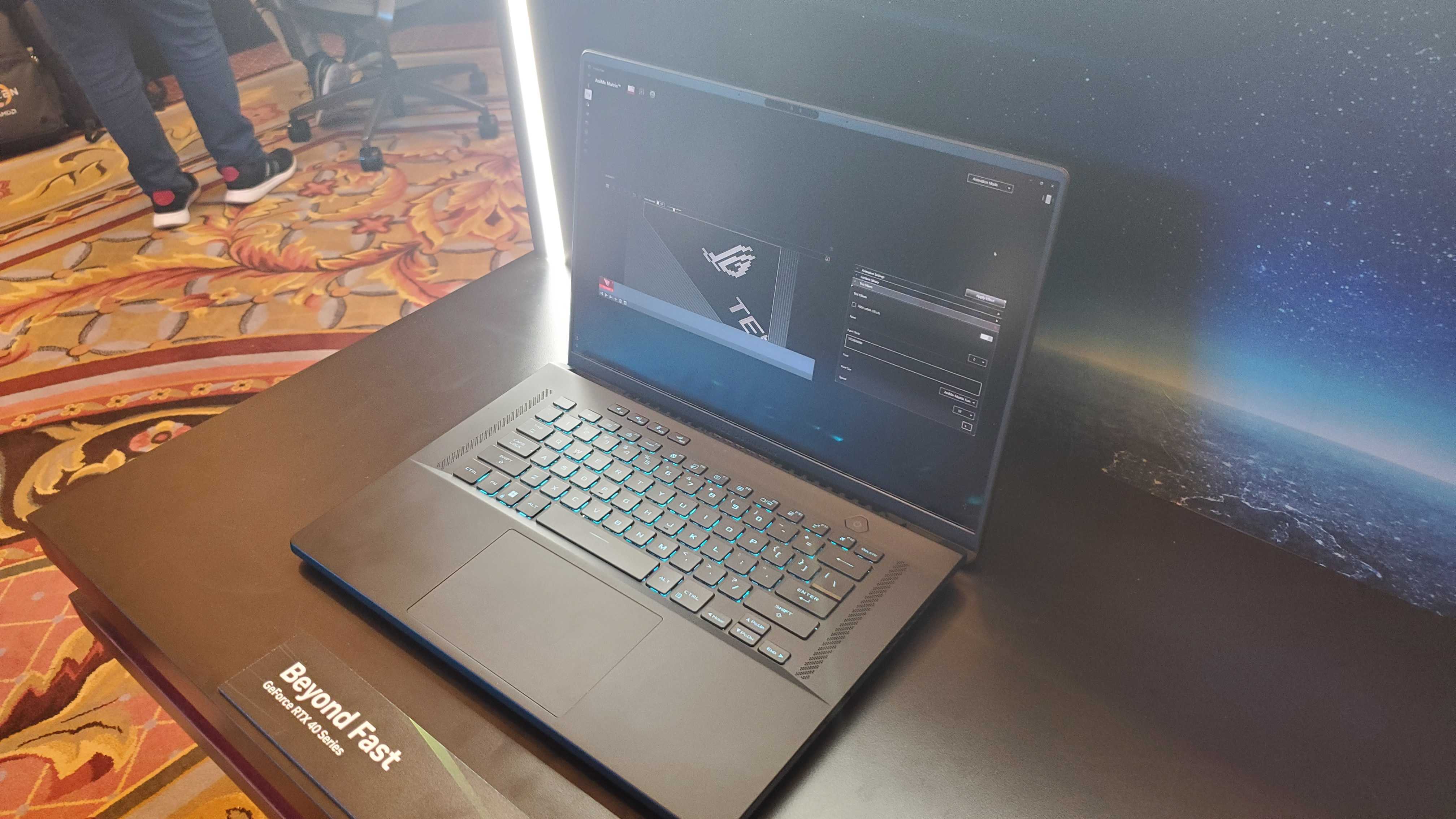 black gaming laptop with lit keyboard
