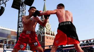 Russia's Vladimir Shishkin (R) trains on a stage ahead of the Scull vs Shishkin live stream