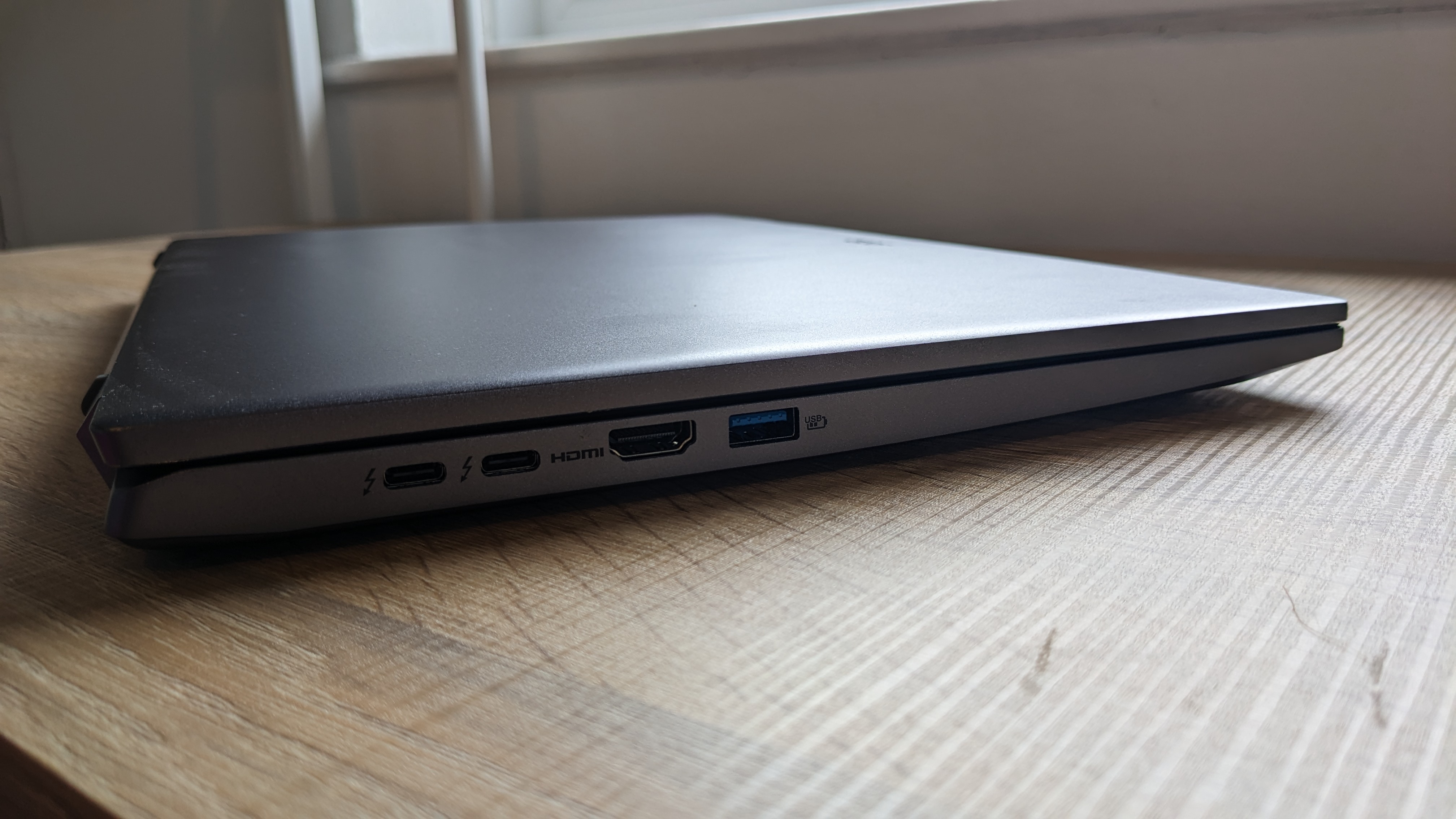 Acer Swift X 16 on wooden table