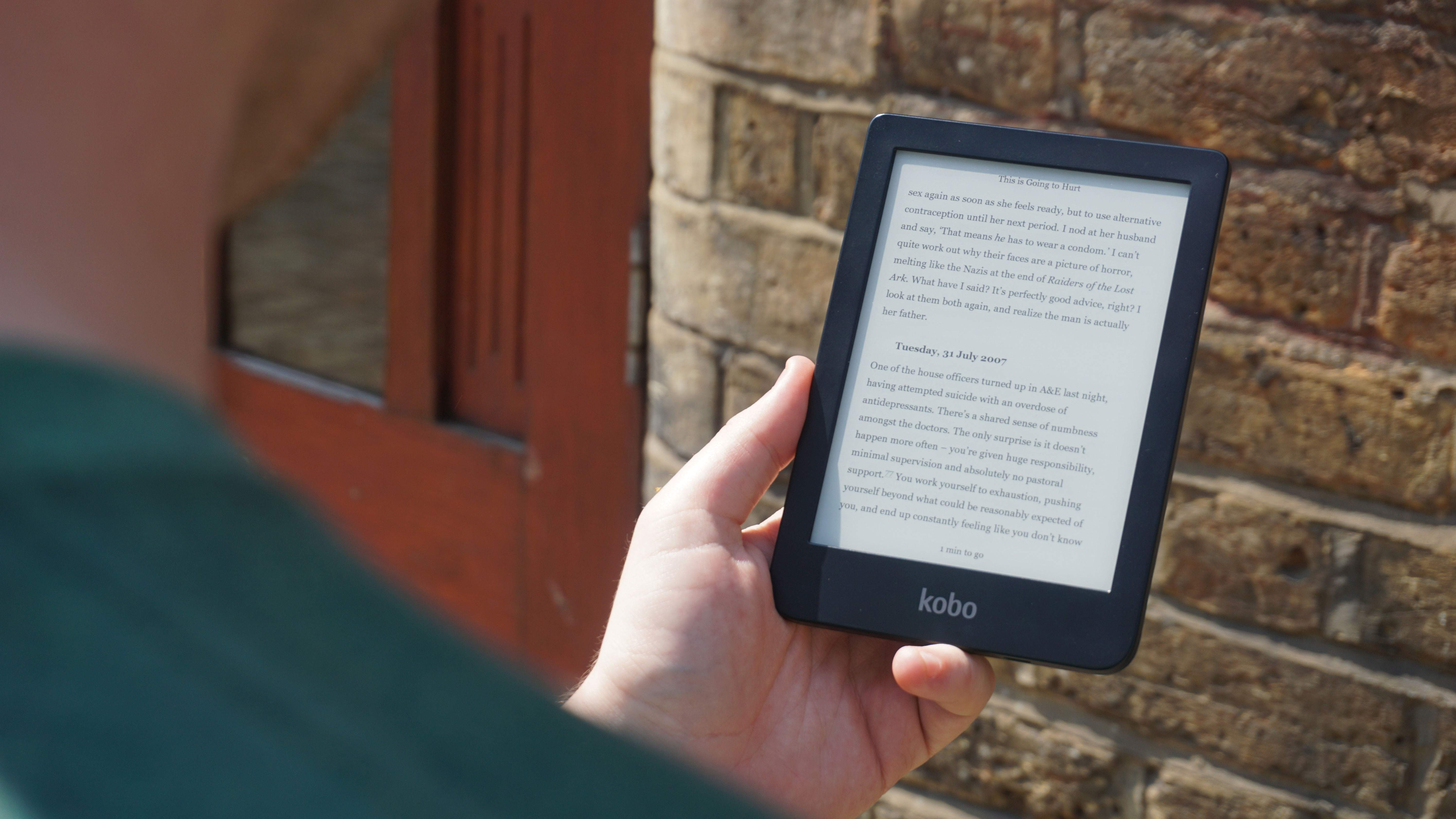 Man using Kobo Clara HD