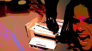 While a robotic arm reaches out to stop the chaos, a foot steps on a piece of office equipment, and a woman screams.