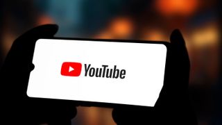 A landscape smartphone with the YouTube logo 