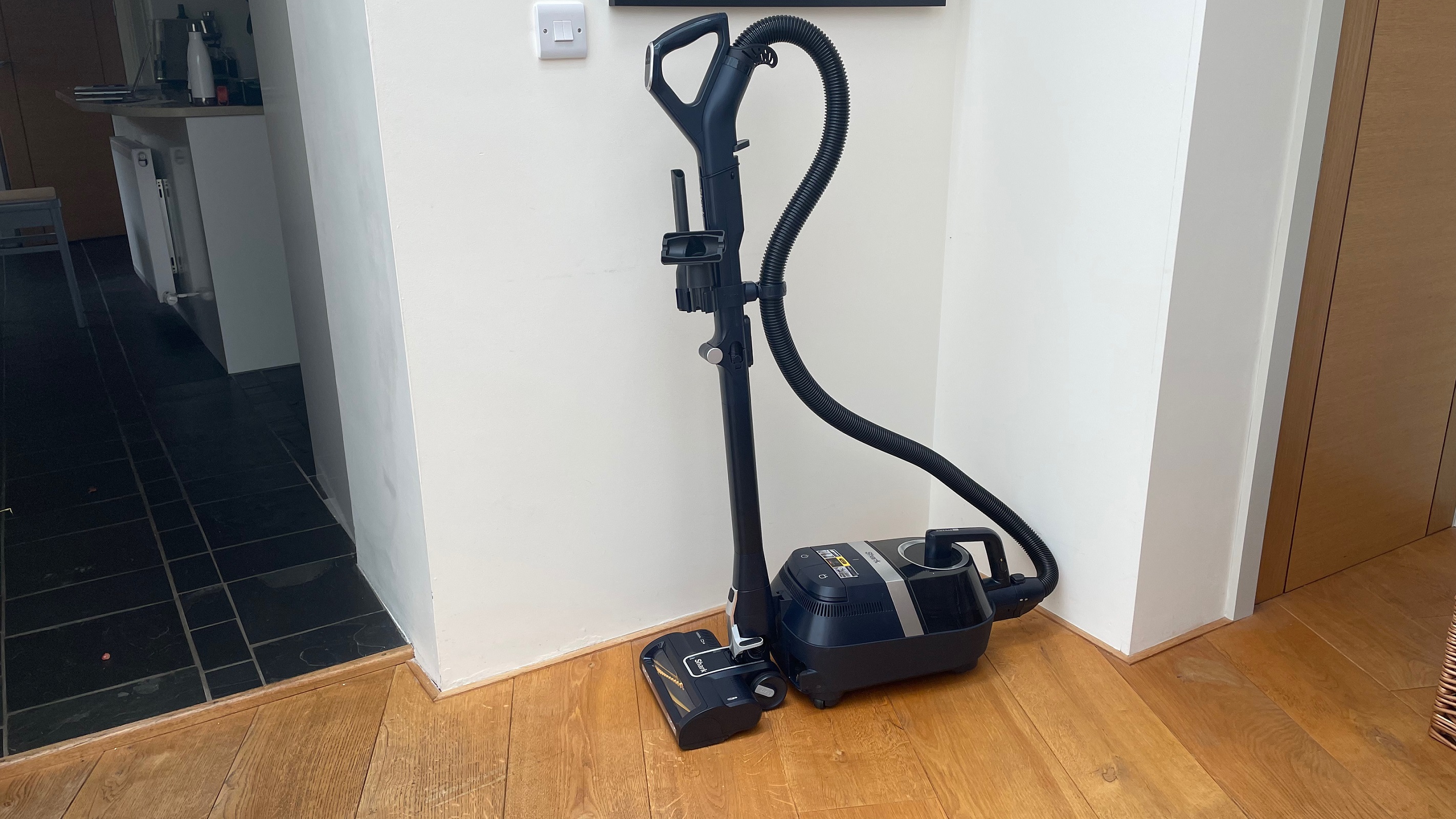Shark Bagless Barrel Vacuum CZ250 stored in a corner