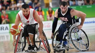 Two men playing wheelchair basketball at the Paralympics