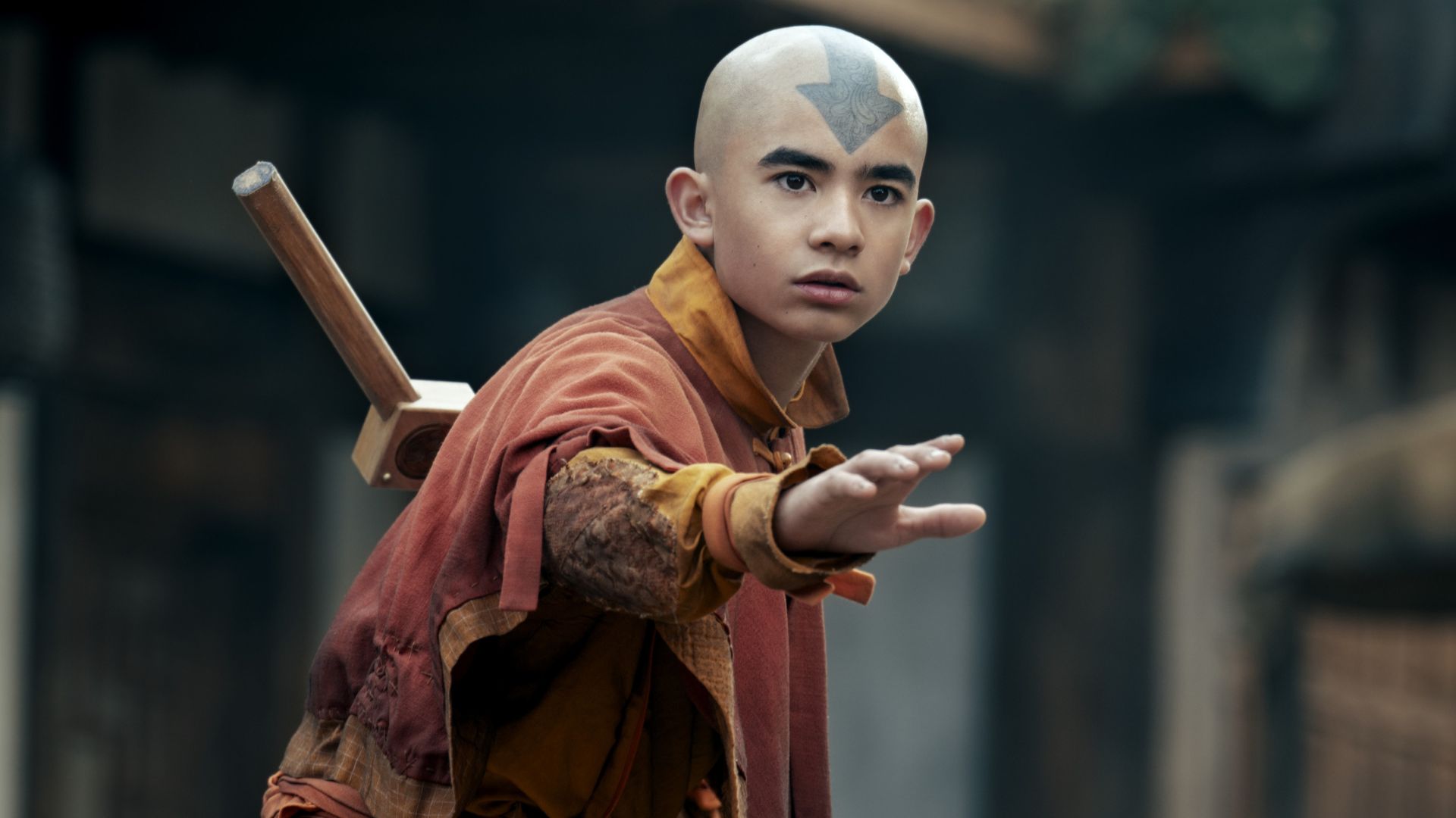 Aang gestures at something offscreen