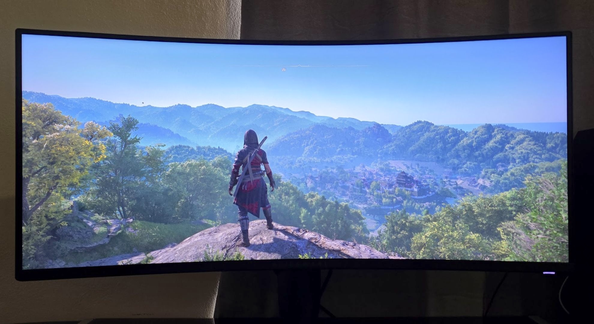 An ultrawide panel displaying Assassin's Creed Shadows