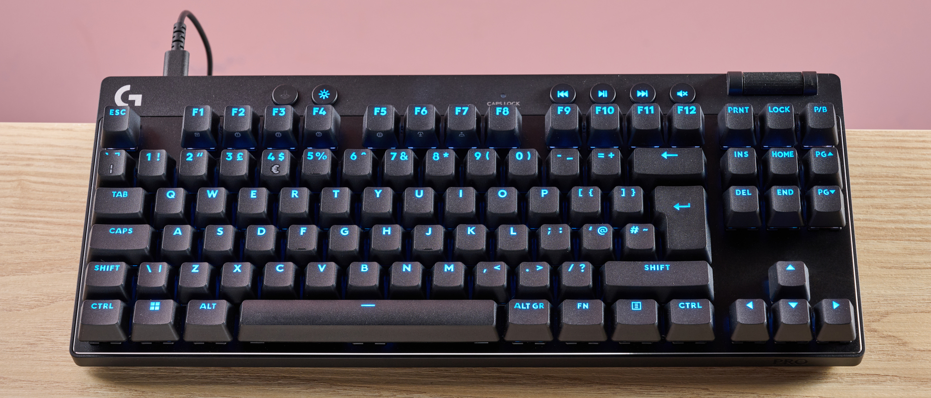 Logitech Pro X TKL Rapid on table with pink background