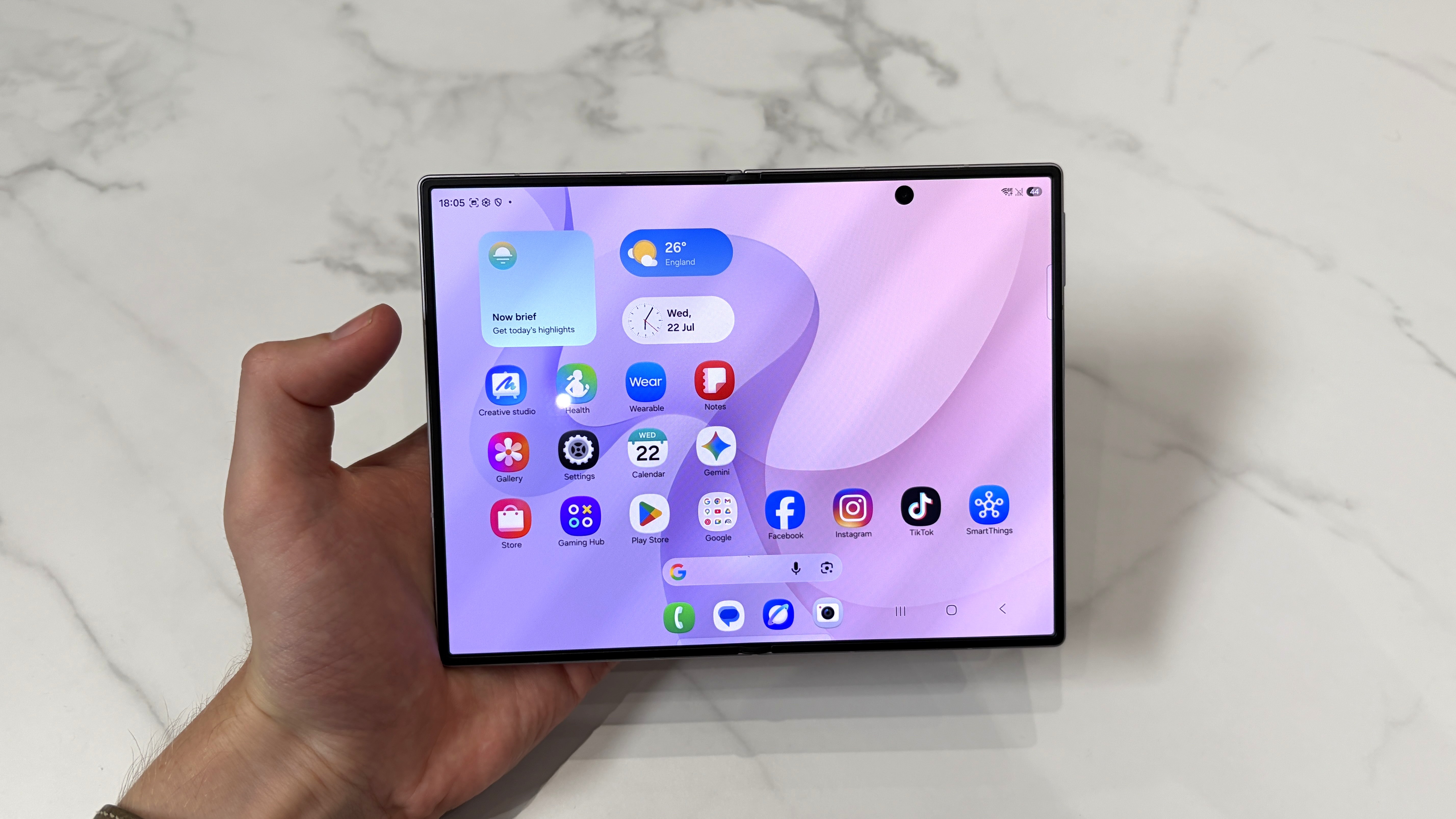 The Samsung Galaxy Z Fold 8 being held in the hand