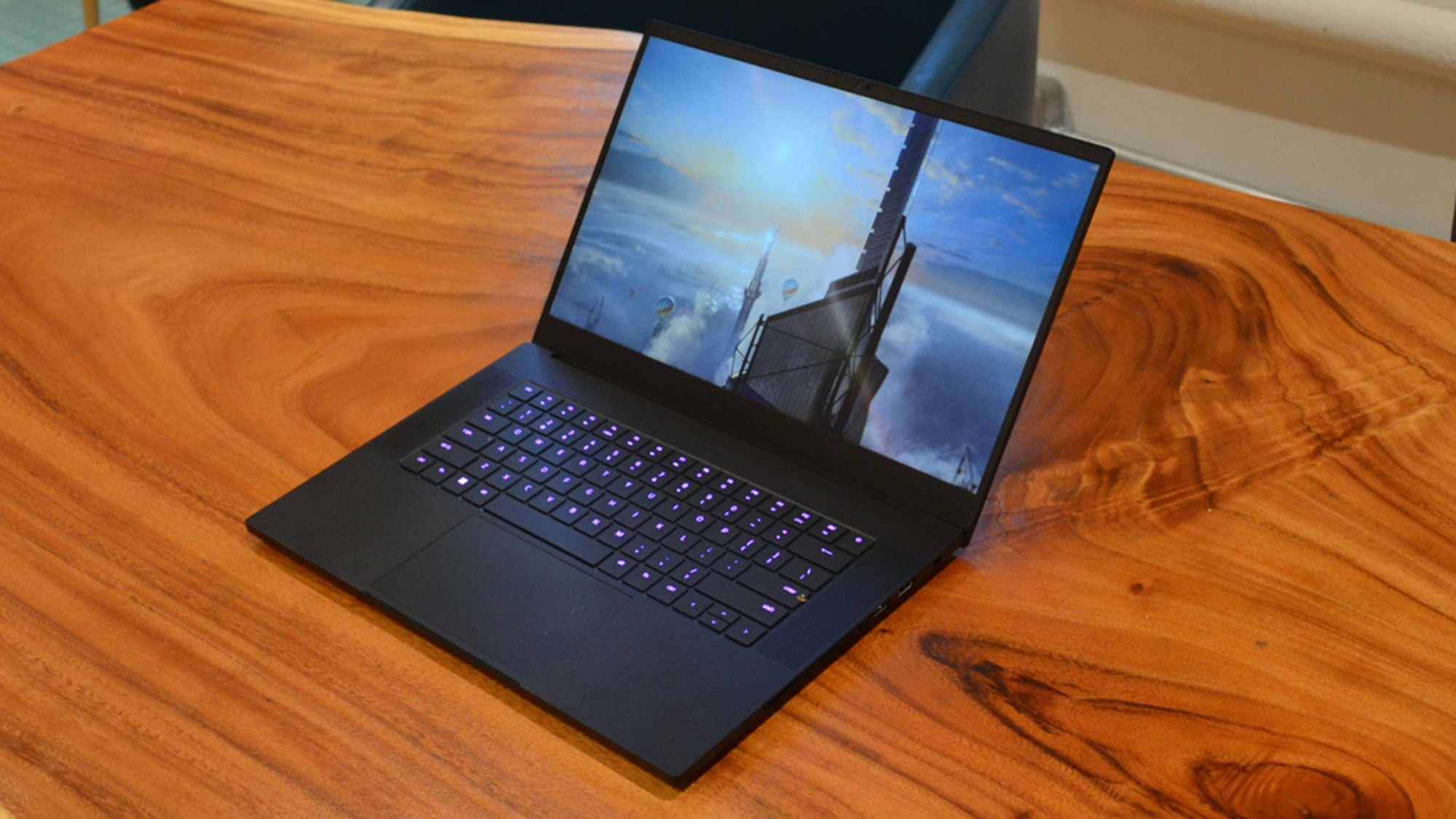 best 15-inch laptop Razer Blade 15 (2022) on a wooden table