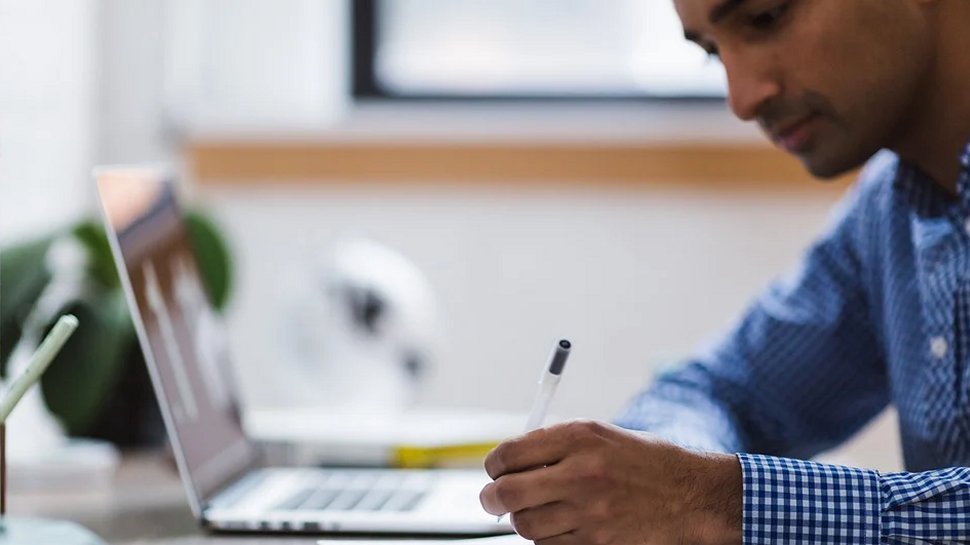 A person working at a laptop.