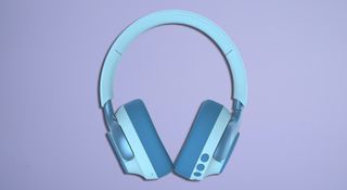 Light blue headphones on a lilac TR background