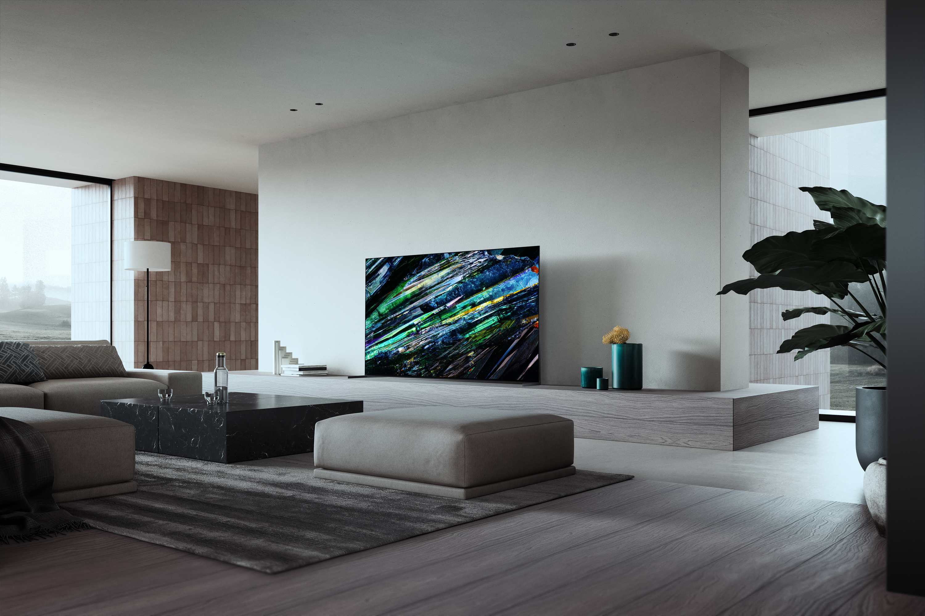 The Sony A95L OLED TV in a large, grey living room.