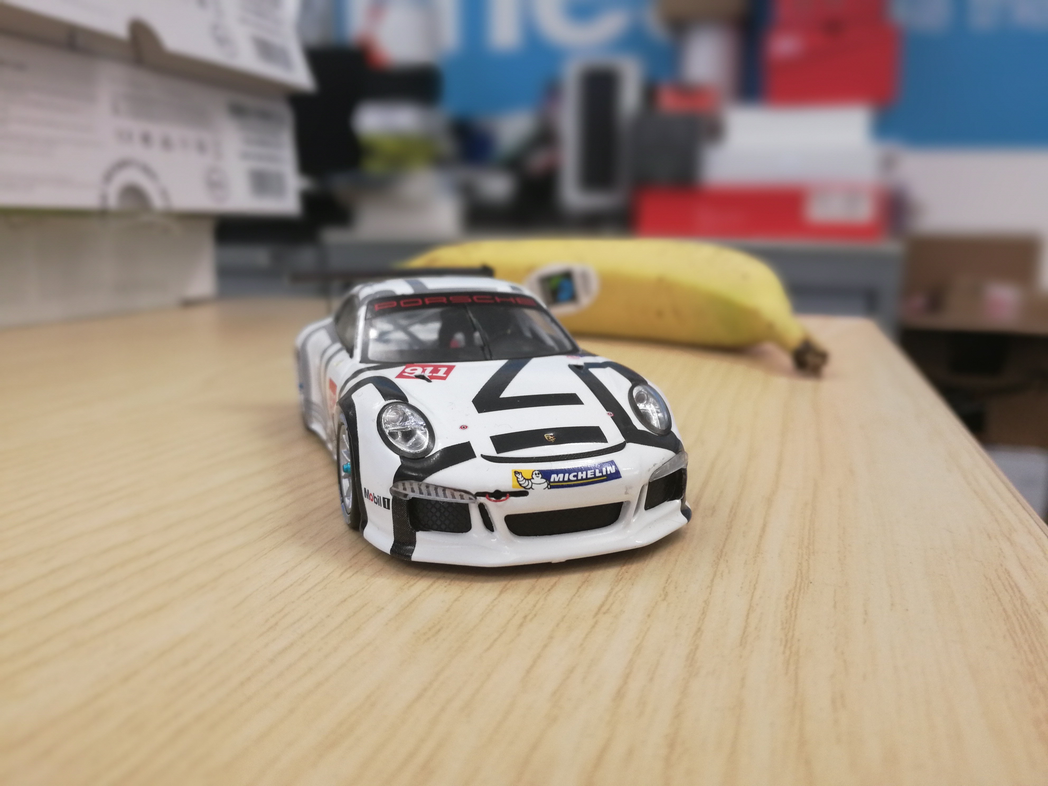 Here's a shot taken in wide aperture mode &amp;ndash; the toy car is in sharp focus, and the background is nicely blurred
