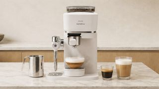 Philips Baristina Latte coffee maker with coffee drinks on kitchen counter