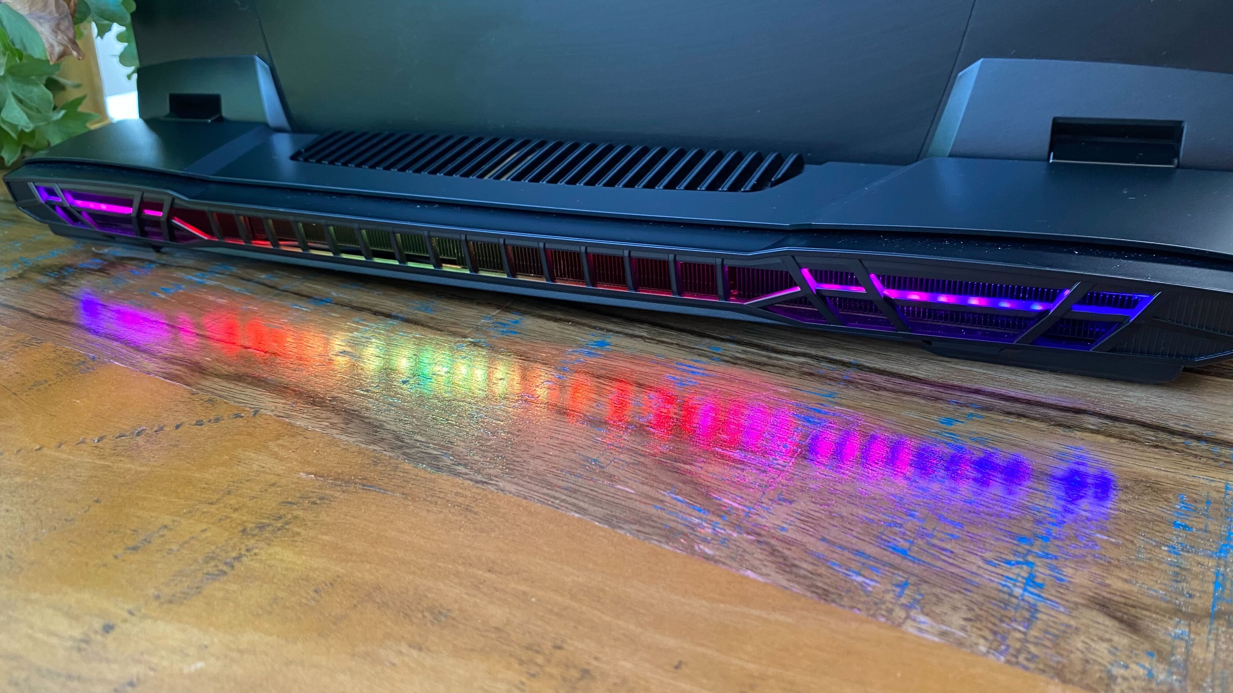 Photos of MSI GT77 on a wooden table at various angles