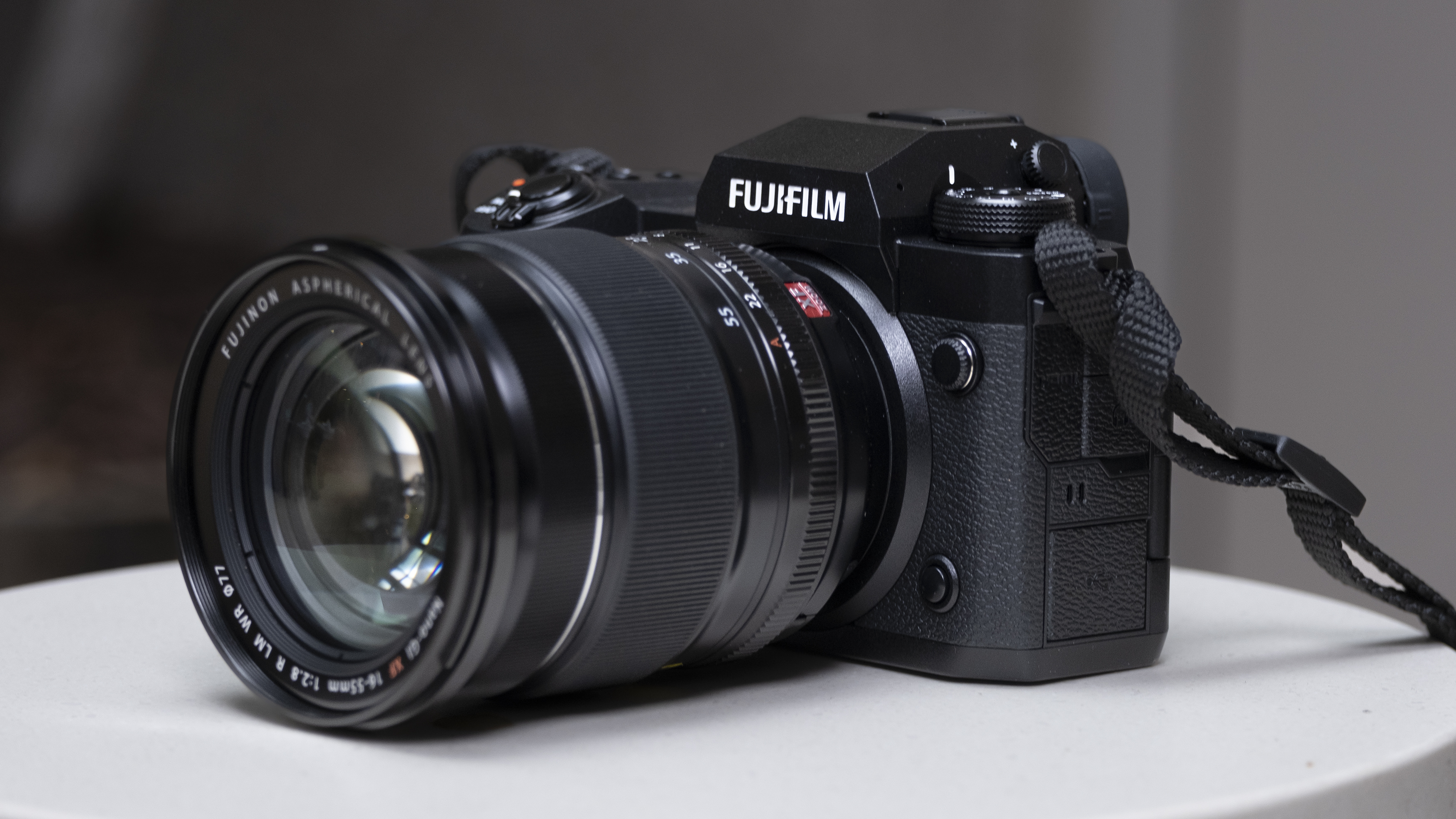 The Fujifilm X-H2 camera setting on a white table