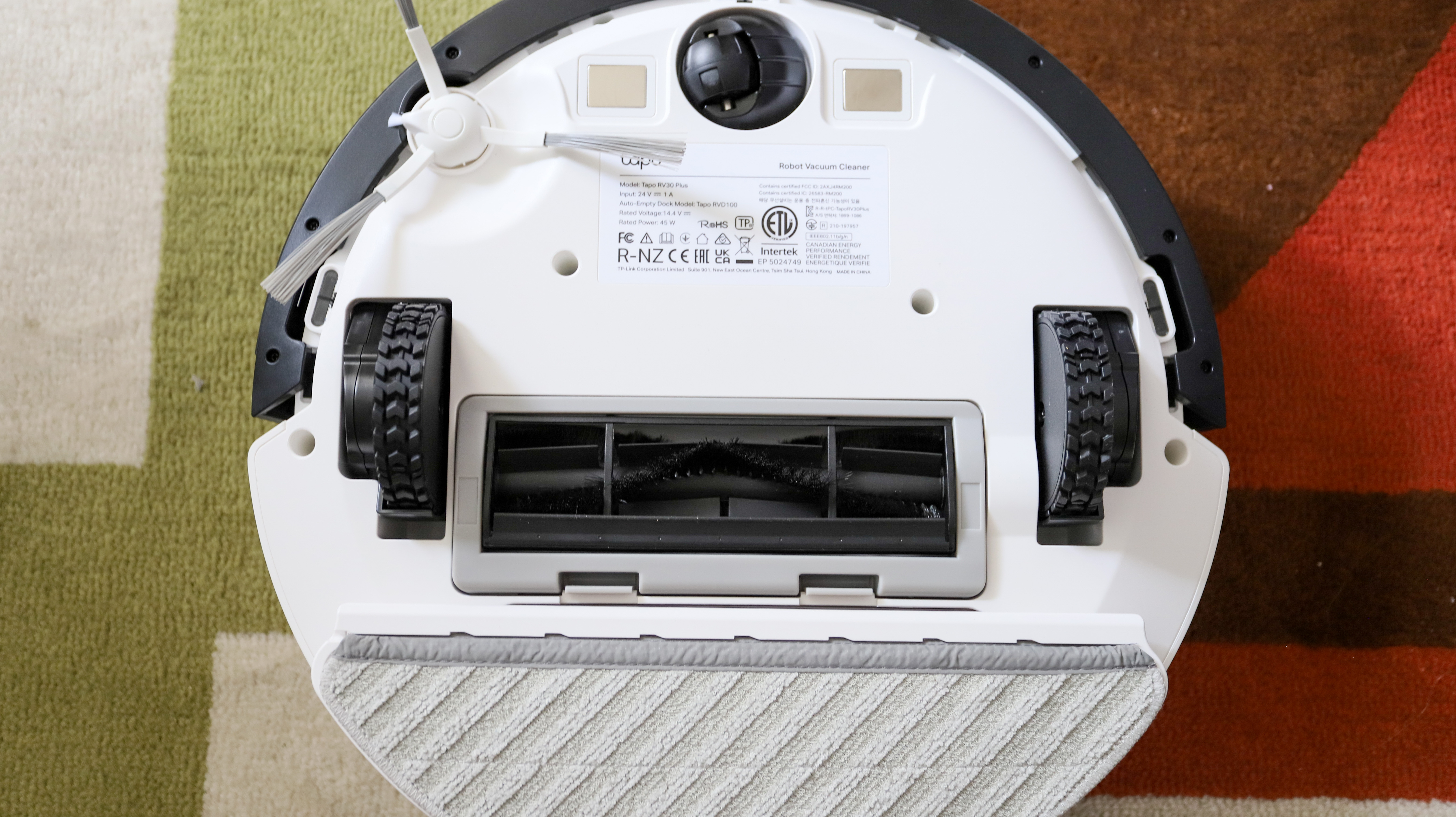 The brushes and mop plate on the underside of the TP-Link Tapo RV30 Plus