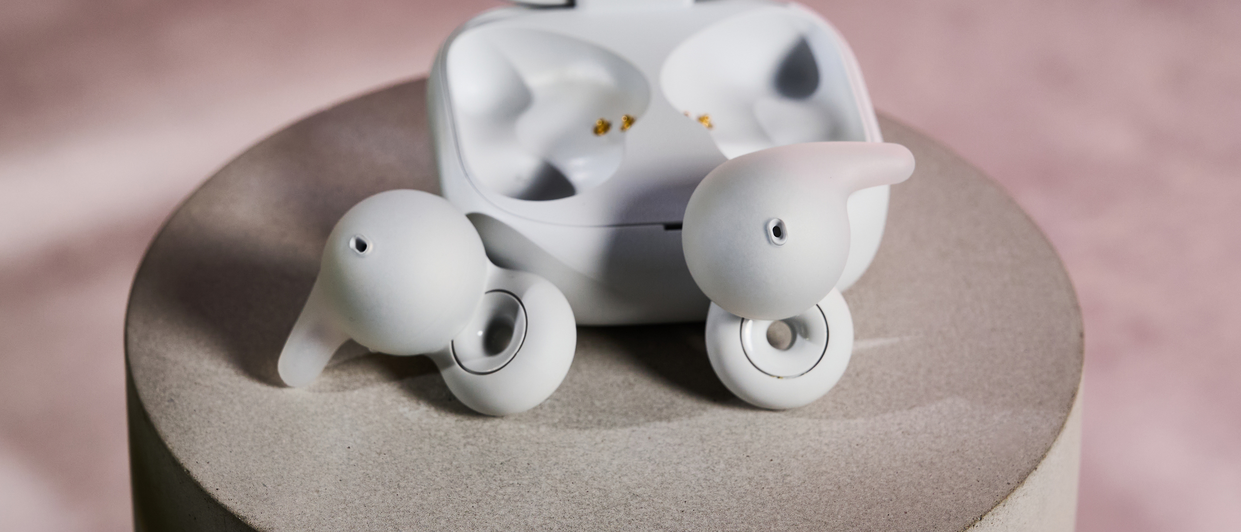 Sony LinkBuds Open buds next to charging case