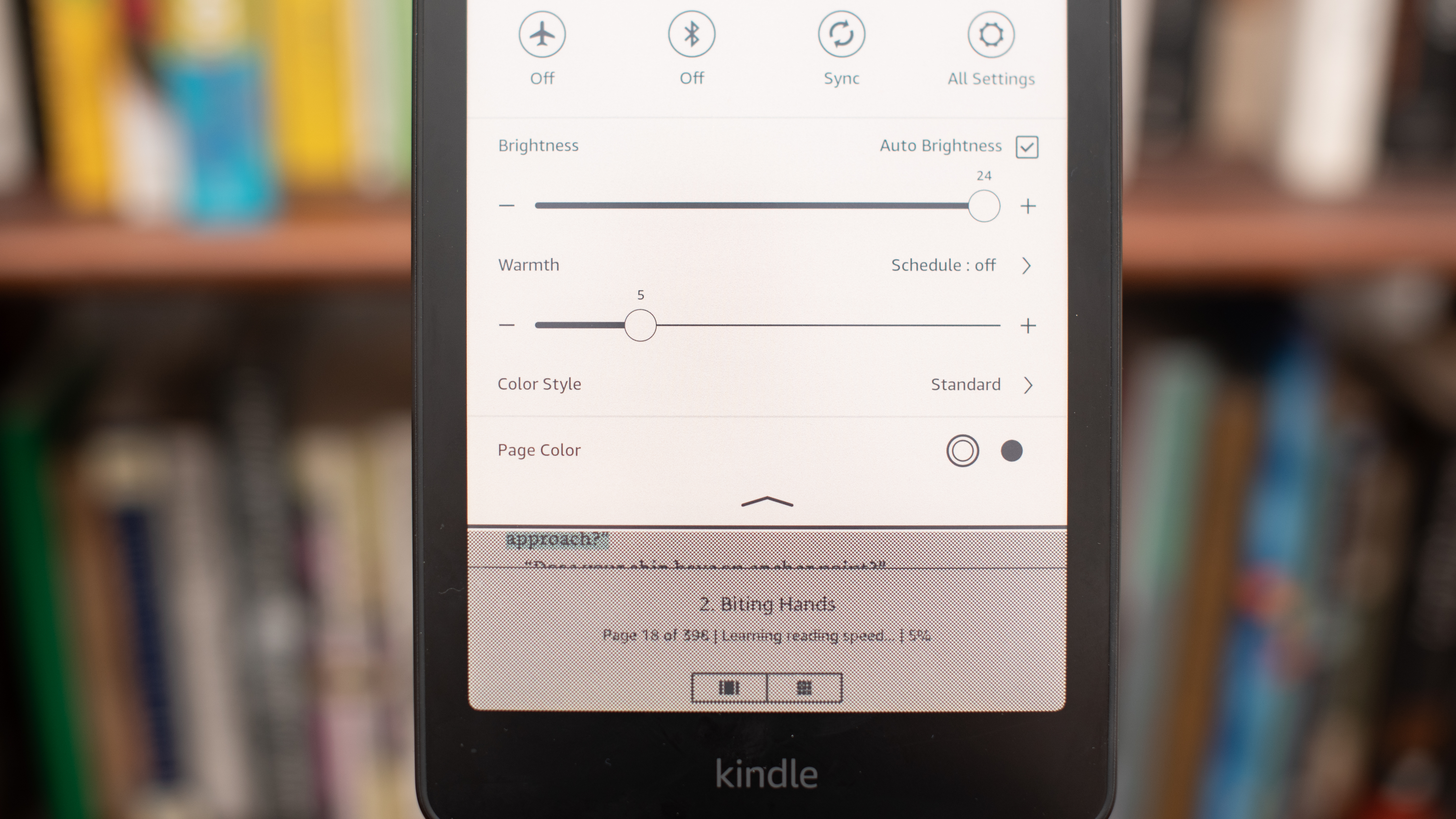 Amazon Kindle Colorsoft Signature edition e-reader showing graphic novels, cookbooks, and fiction, as well as settings